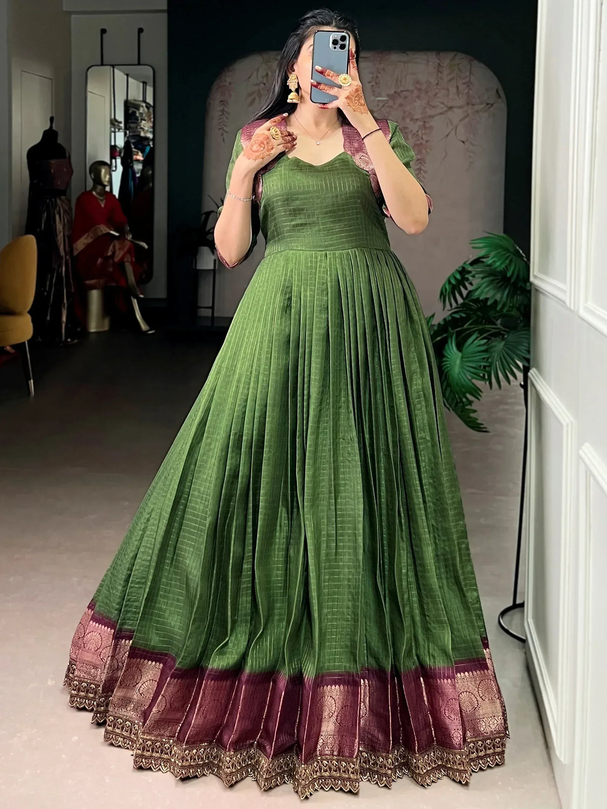 Green ethnic gown with maroon border, perfect for Indian weddings and festive occasions.