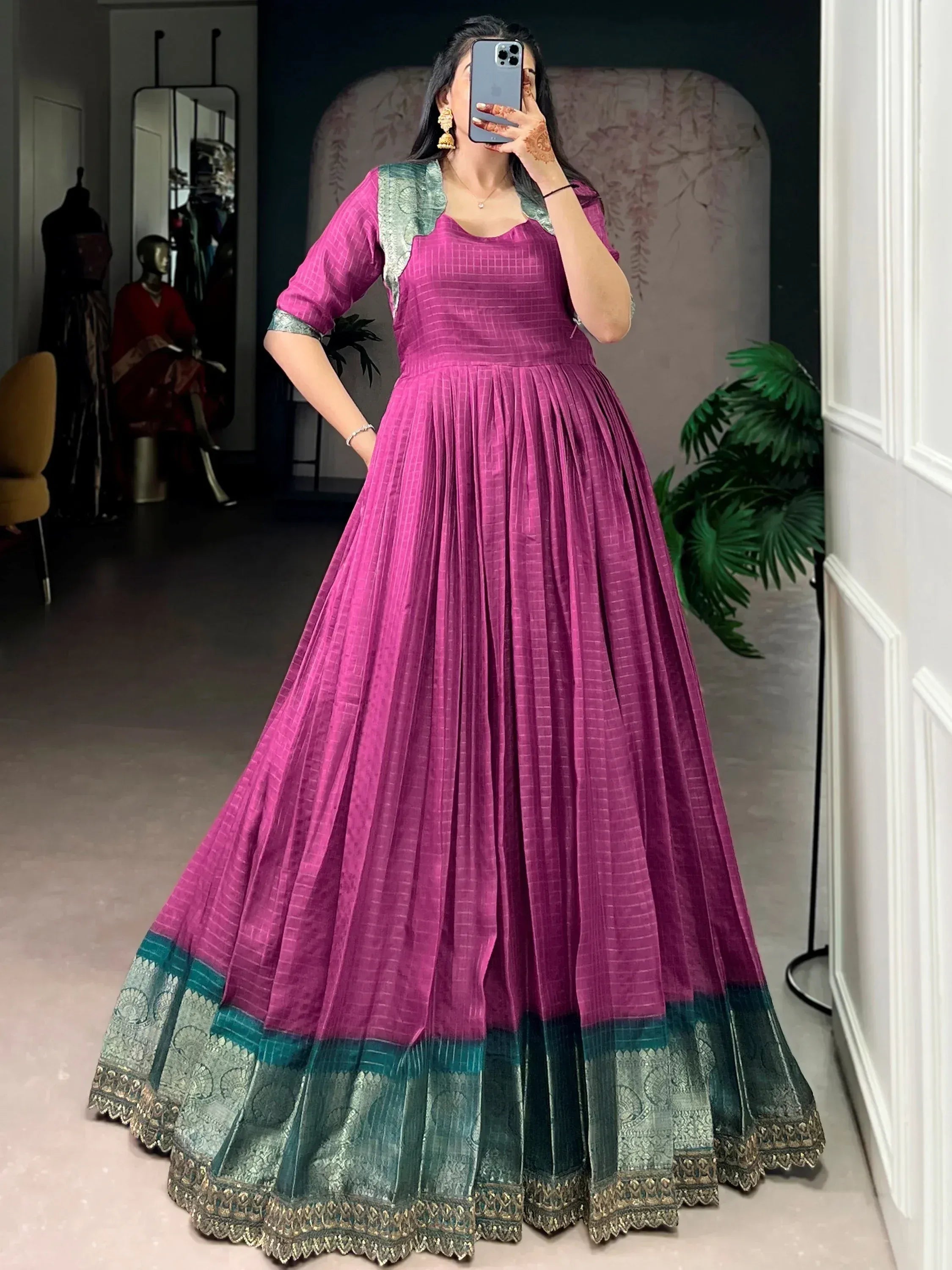 Magenta ethnic gown with green border, perfect for Indian occasions and festive wear.