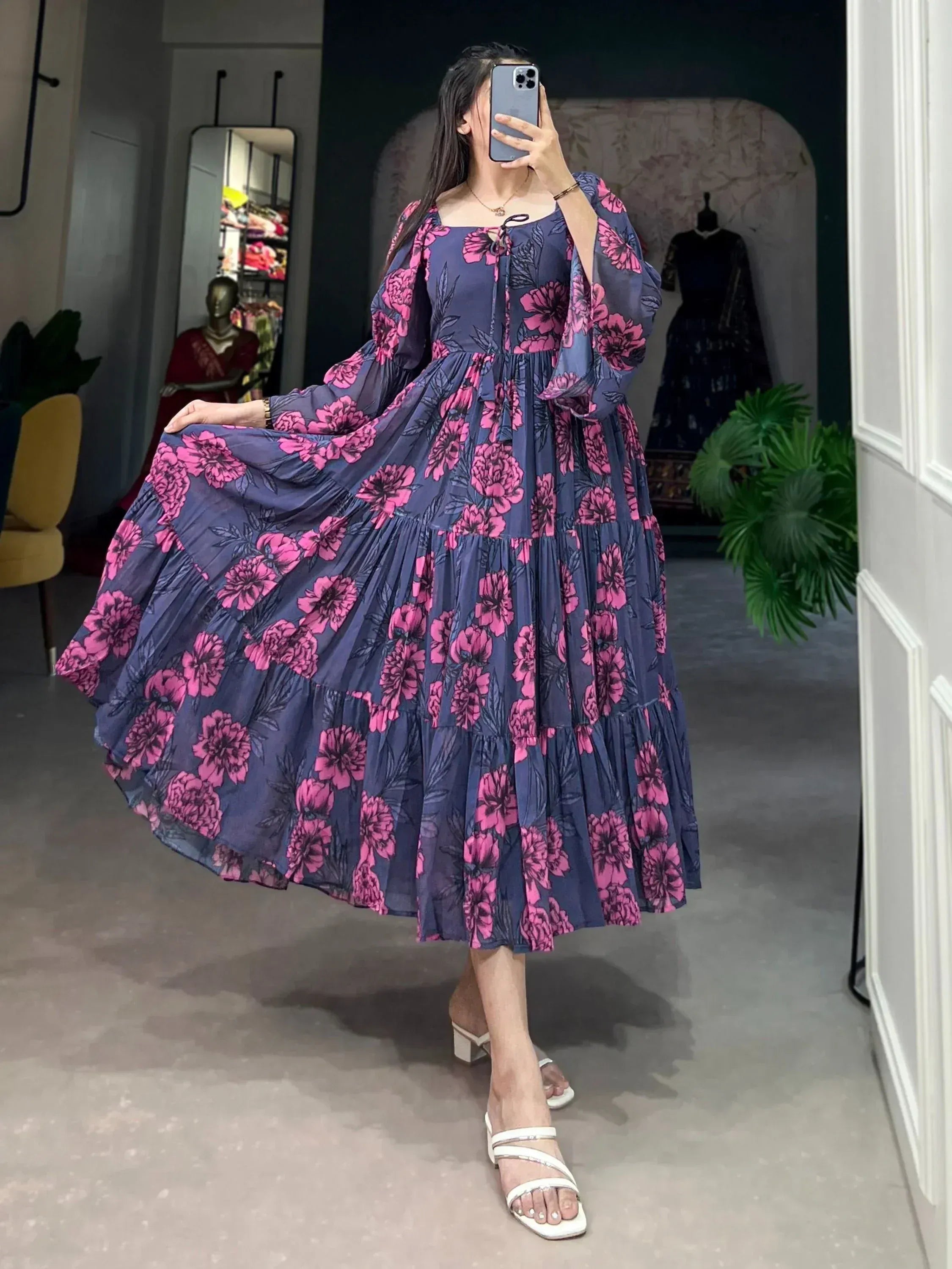 Navy blue floral ethnic gown with pink blooms, tiered skirt, and puff sleeves for women