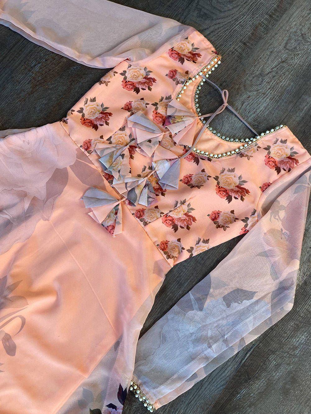 Pink floral print ethnic top with pearl trim and ruffle detail, perfect for Indian wear
