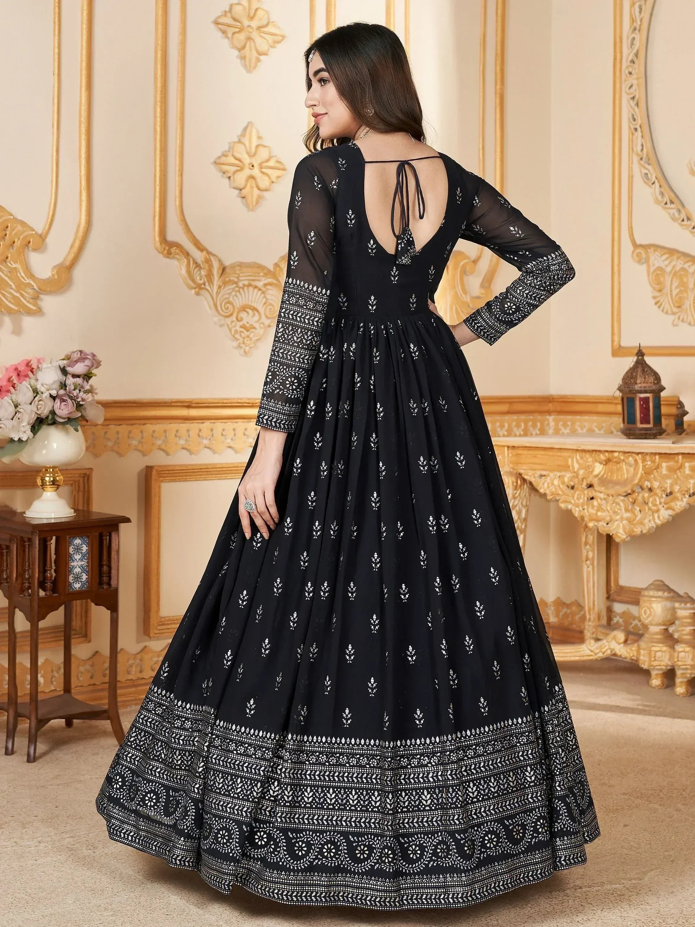 Black ethnic gown with white block print, back tie detail, and flared skirt for festive occasions