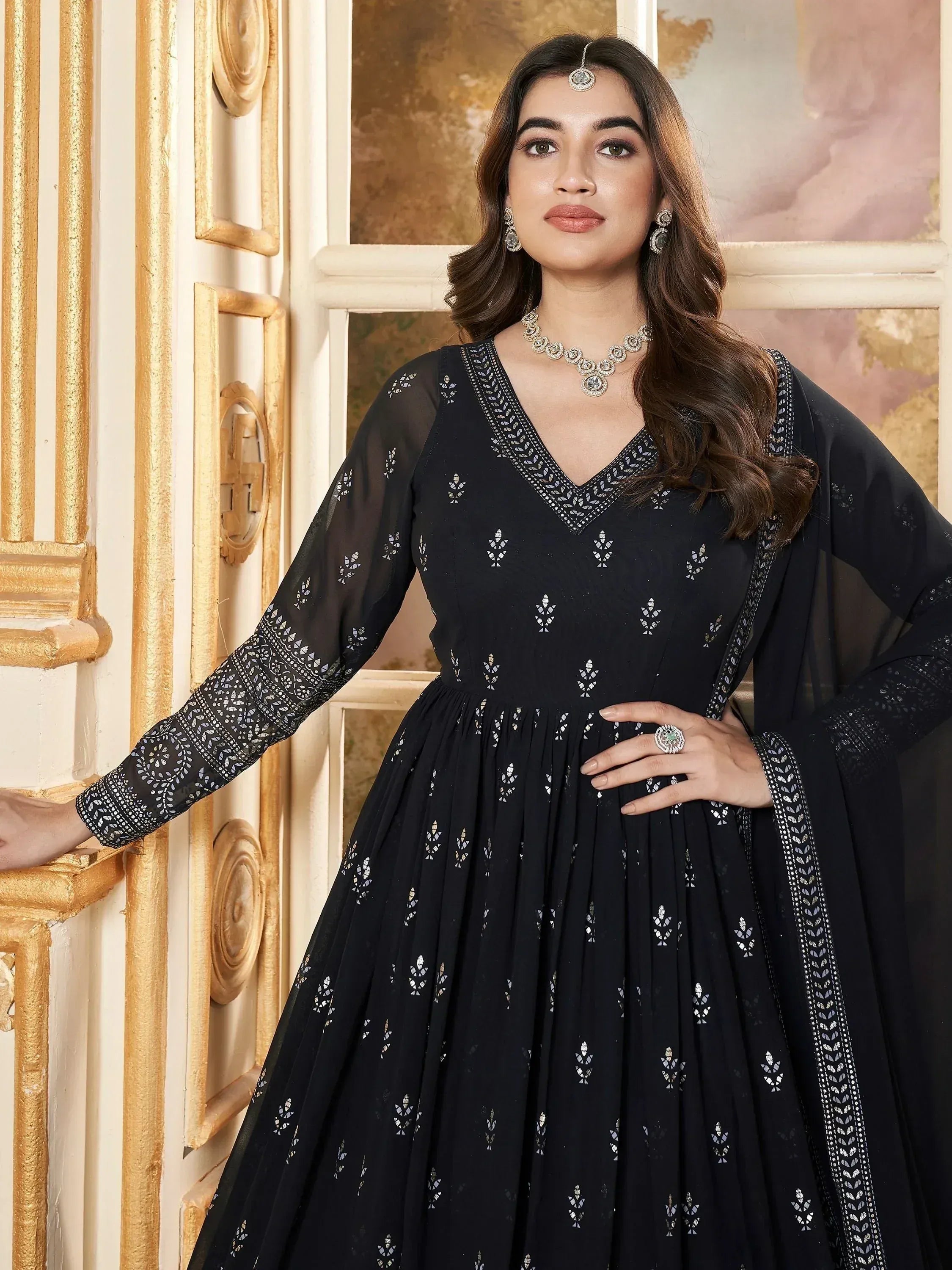 Black embroidered ethnic gown with sheer sleeves, perfect for Indian occasions and festive wear.