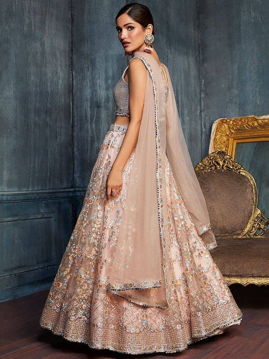 Elegant blush pink embroidered lehenga choli with sheer dupatta, perfect for weddings and festive occasions