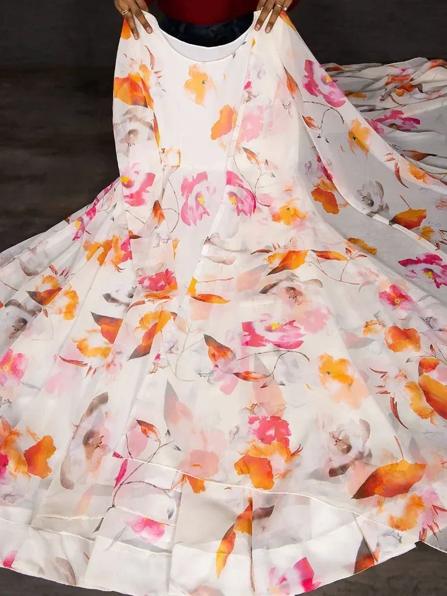 Floral print ethnic gown with vibrant pink and orange blooms, perfect for Indian occasions