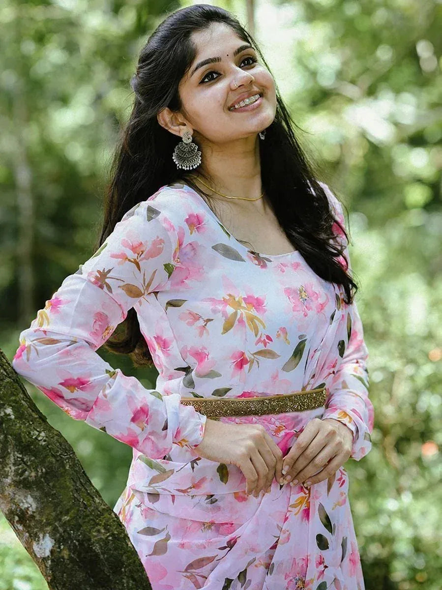 Woman in floral print ethnic gown with gold belt, perfect for Indian occasions