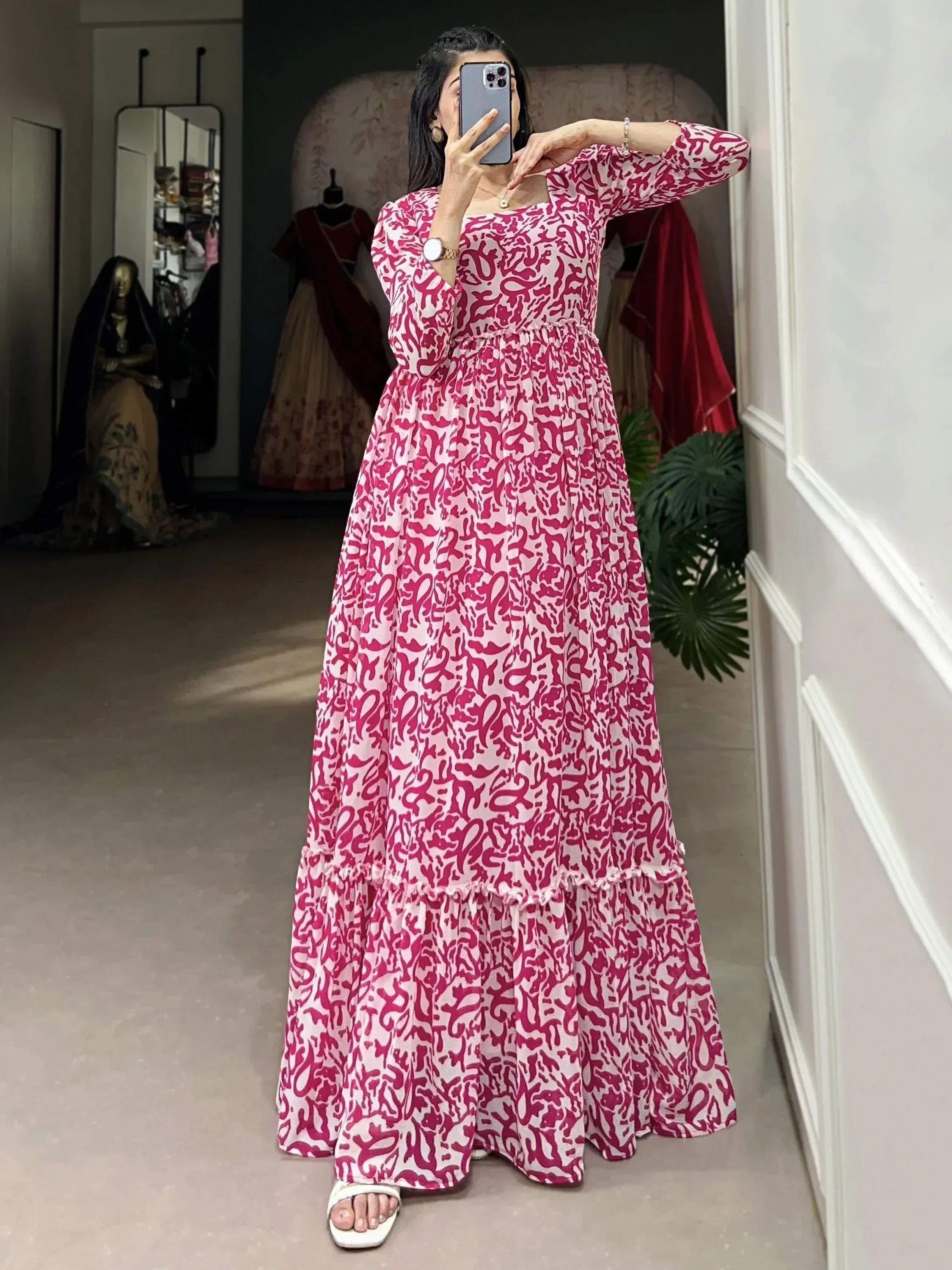 Pink and white printed ethnic gown with flared design, perfect for festive occasions