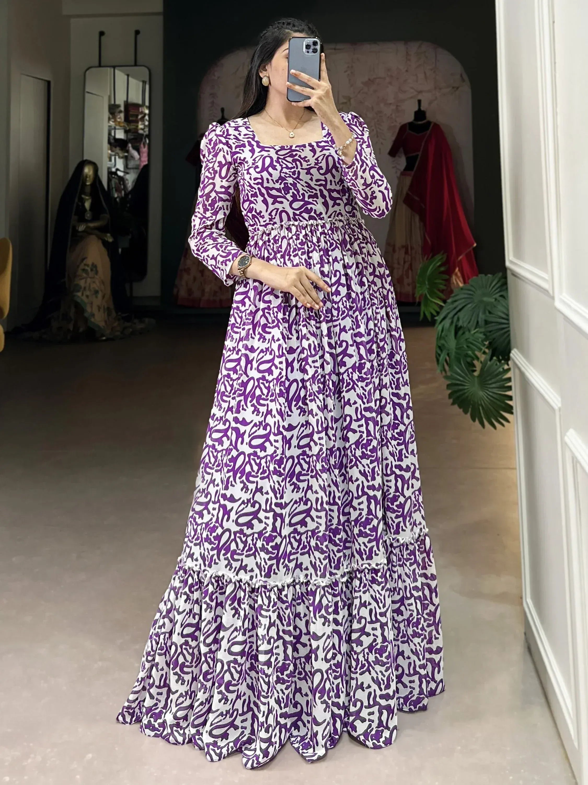 Purple and white printed ethnic gown with puff sleeves, perfect for Indian occasions and festive wear.