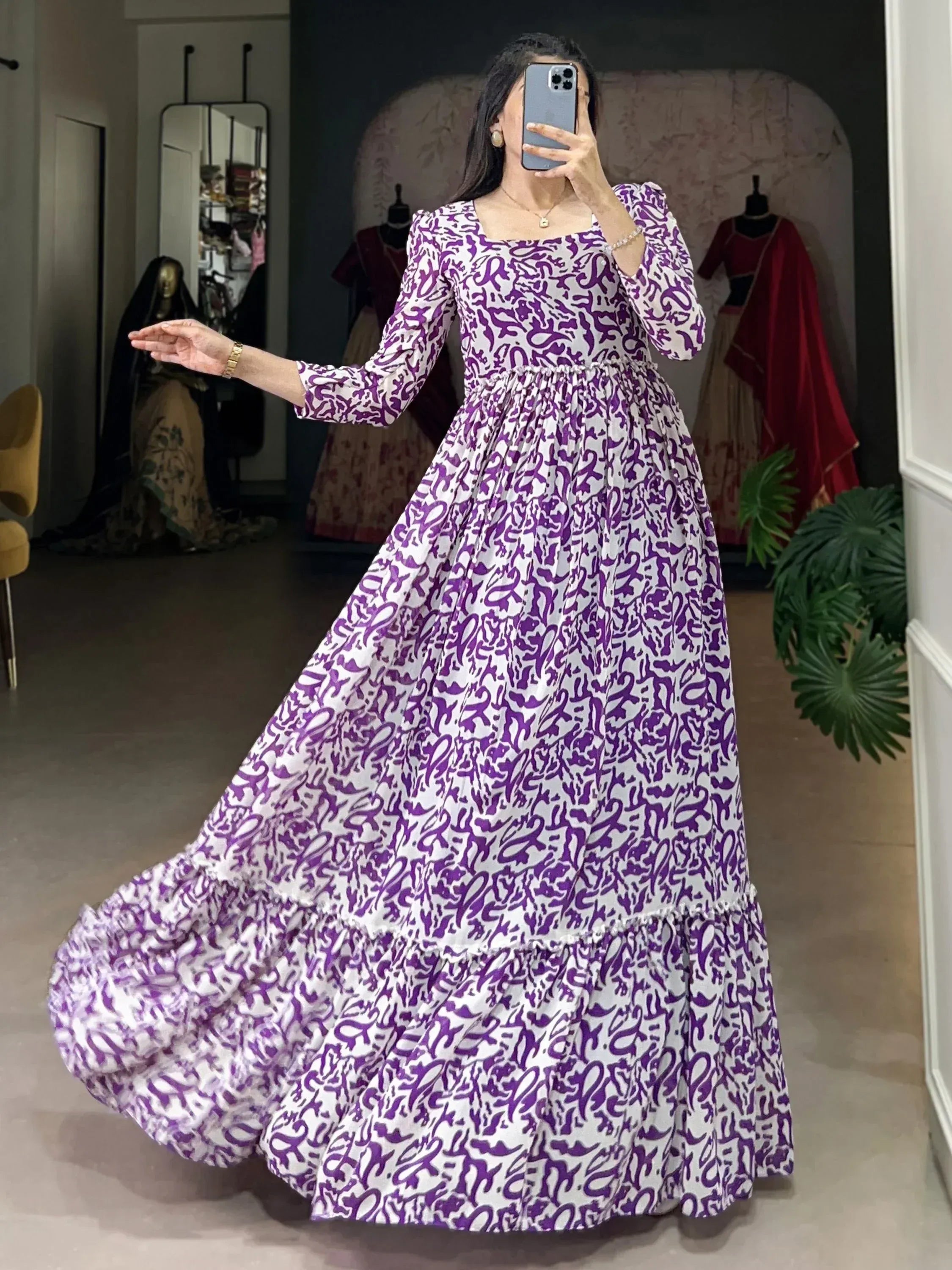 Purple and white printed ethnic gown with flared skirt and puff sleeves
