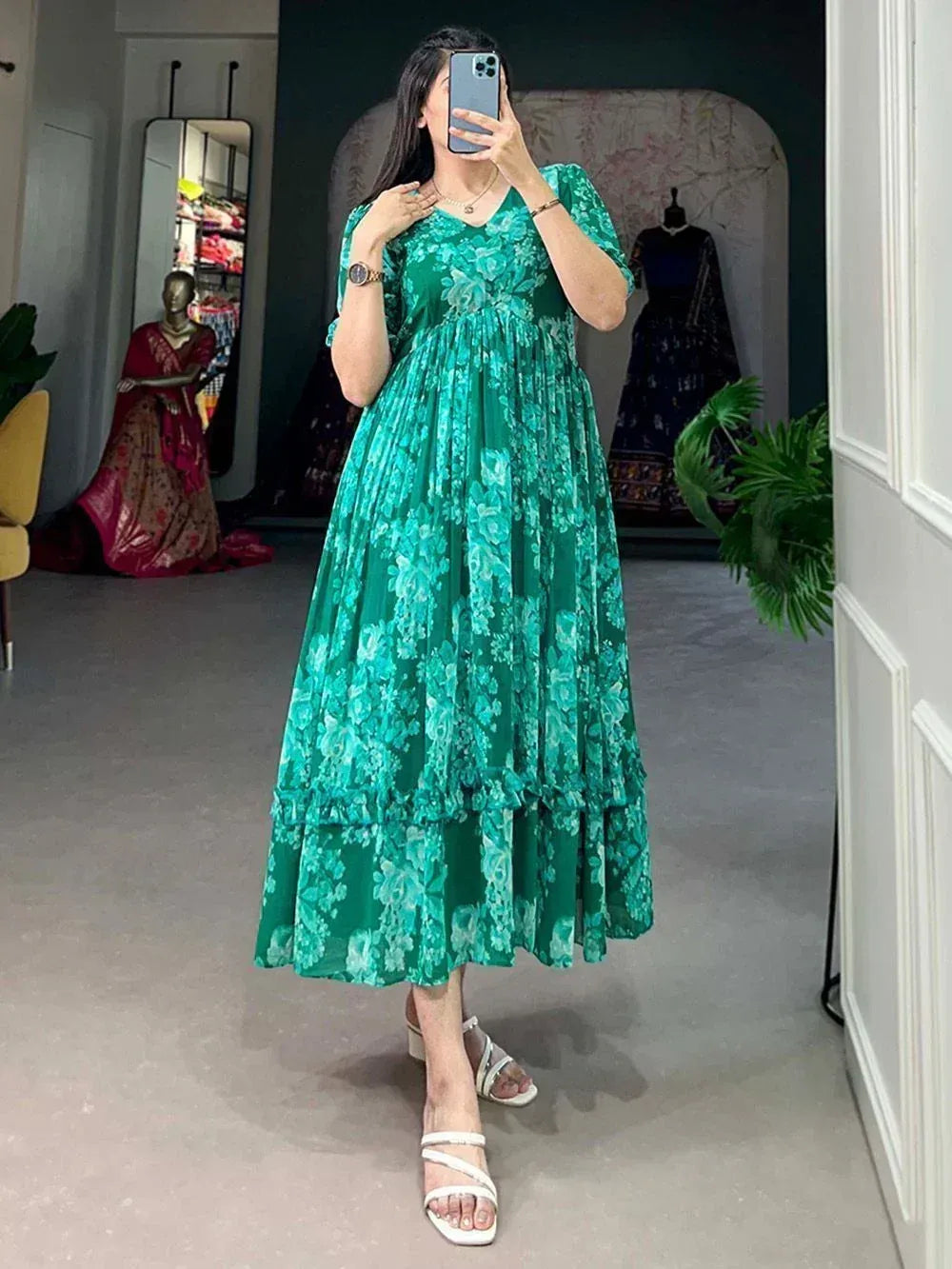 Green floral print ethnic gown with ruffled layers, perfect for Indian occasions and festive wear.