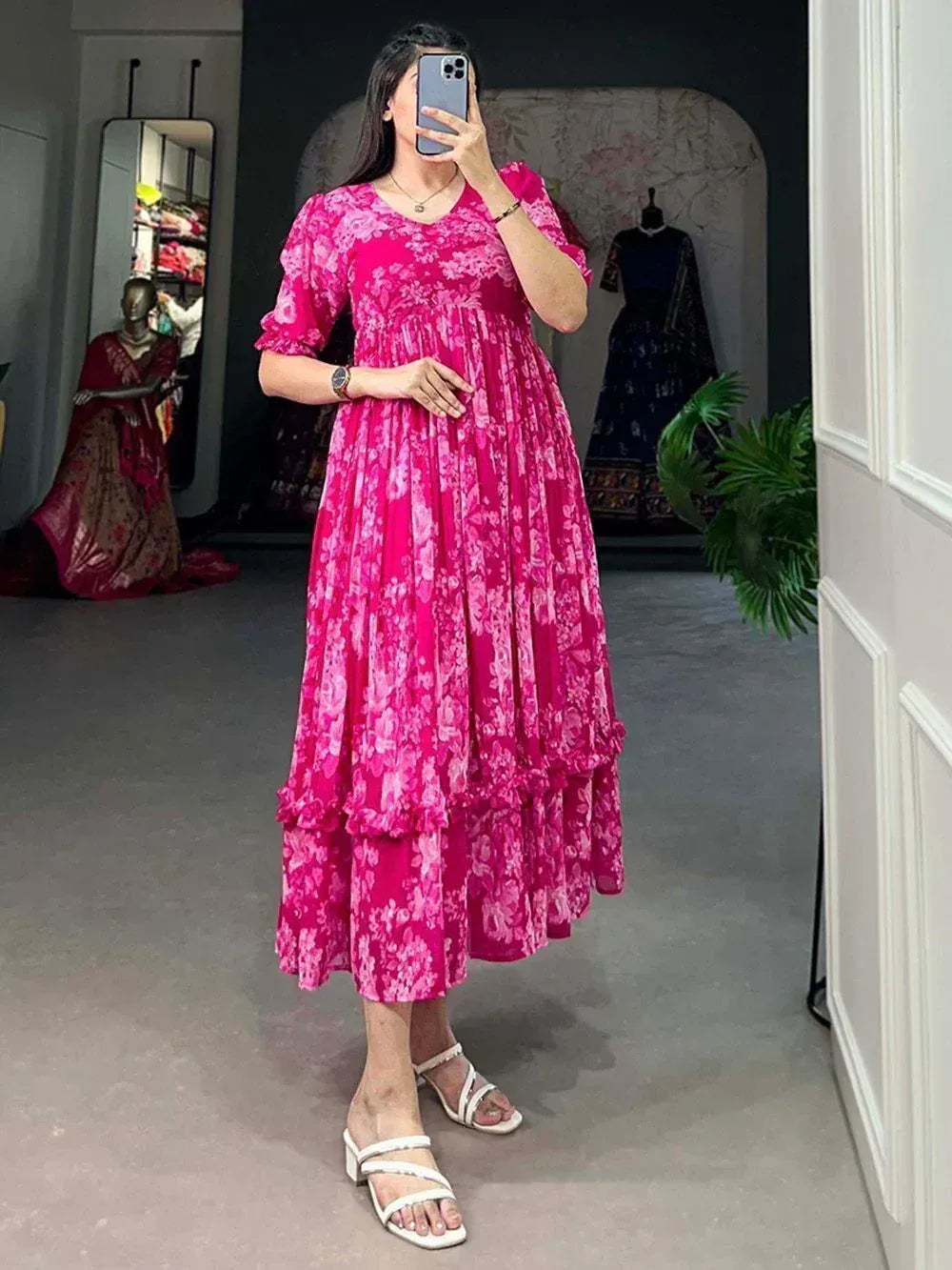 Pink floral ethnic gown with ruffled layers, perfect for Indian occasions and festive wear.