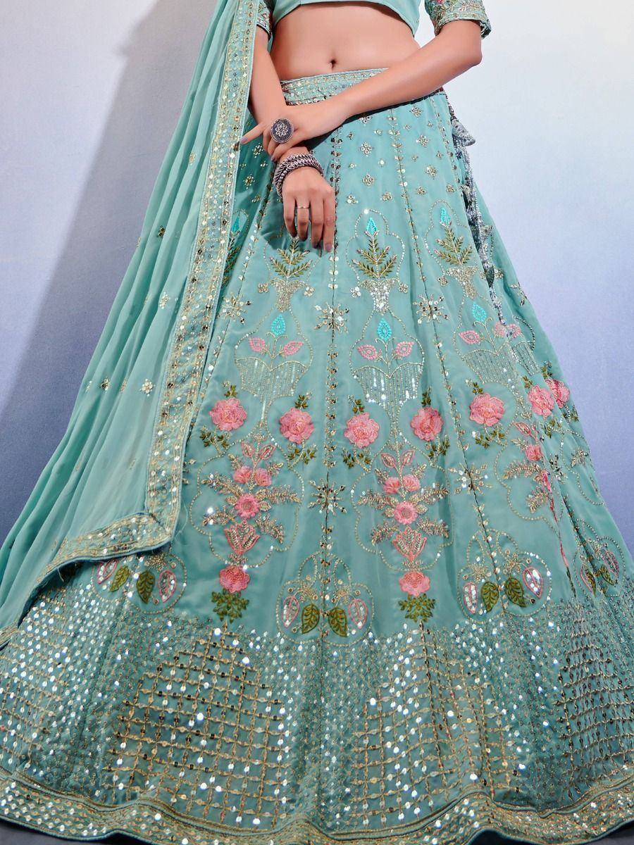 Mint green lehenga choli with pink floral embroidery and gold sequin work, perfect for Indian ethnic wear occasions.