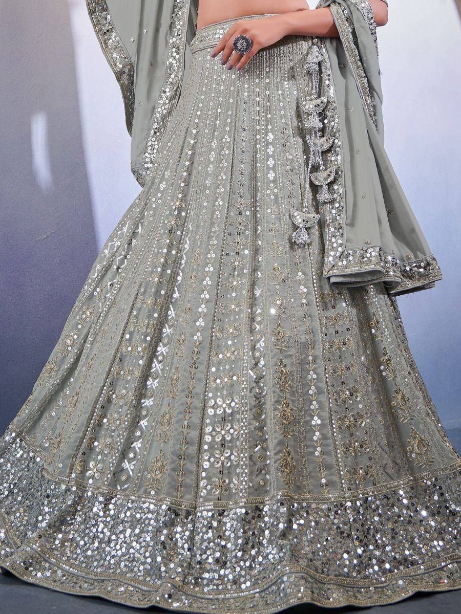 Elegant grey lehenga choli with intricate silver sequin and embroidery work, perfect for Indian ethnic occasions.