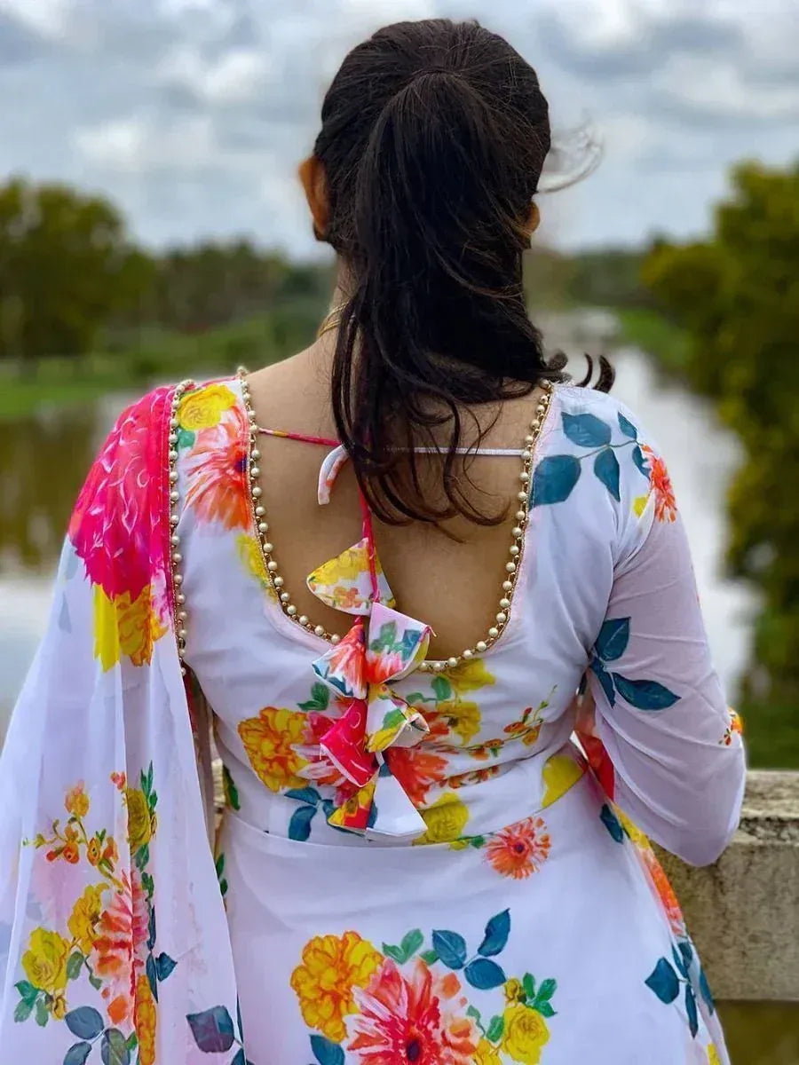 Floral print ethnic gown with pearl trim and back bow, perfect for Indian occasions