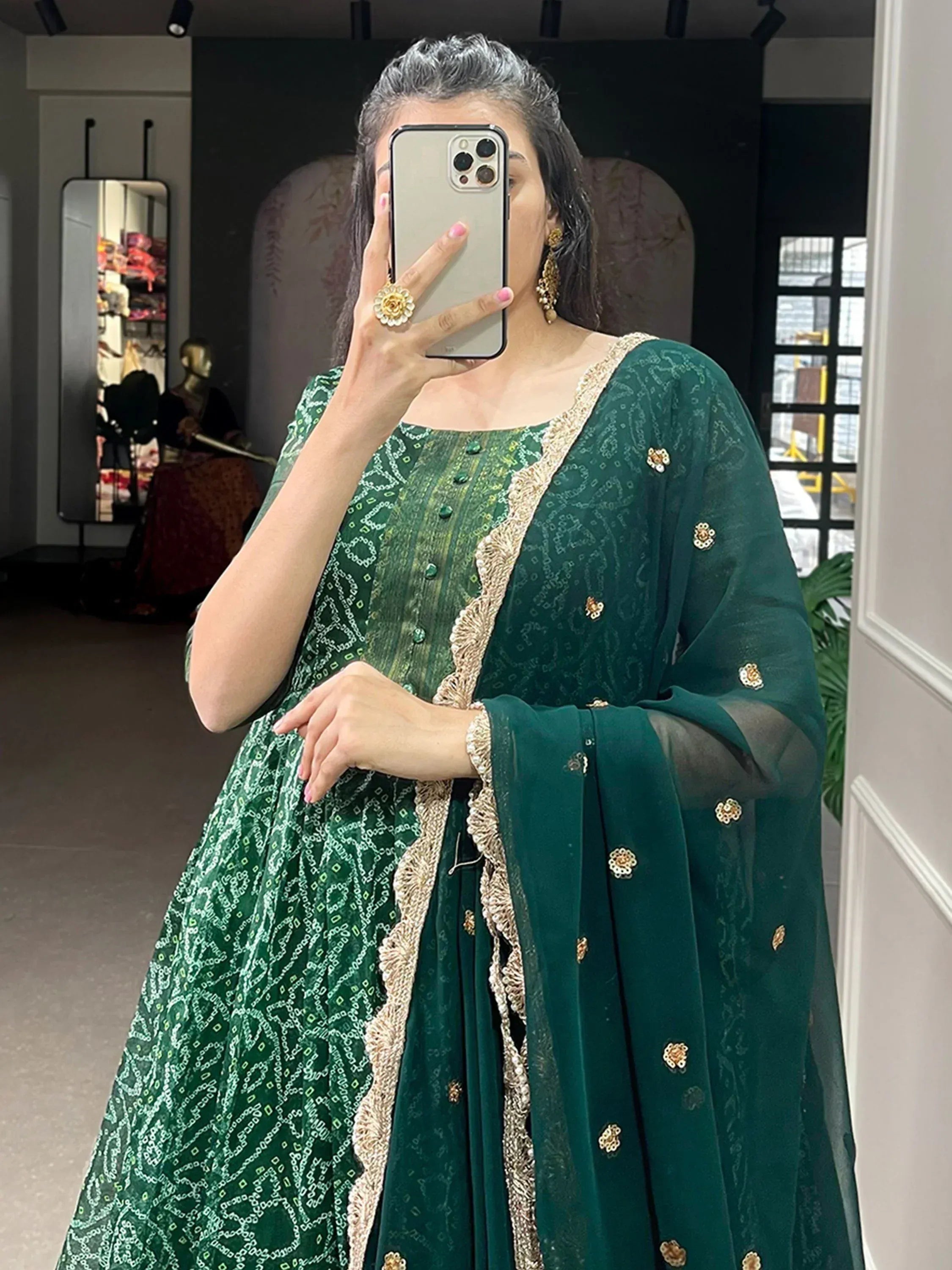 Emerald green embroidered salwar kameez with gold detailing, perfect for Indian ethnic wear occasions.