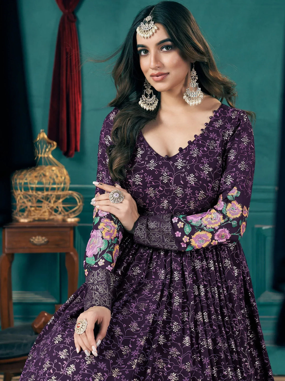 Purple floral ethnic gown with intricate embroidery, perfect for Indian celebrations and festive occasions.