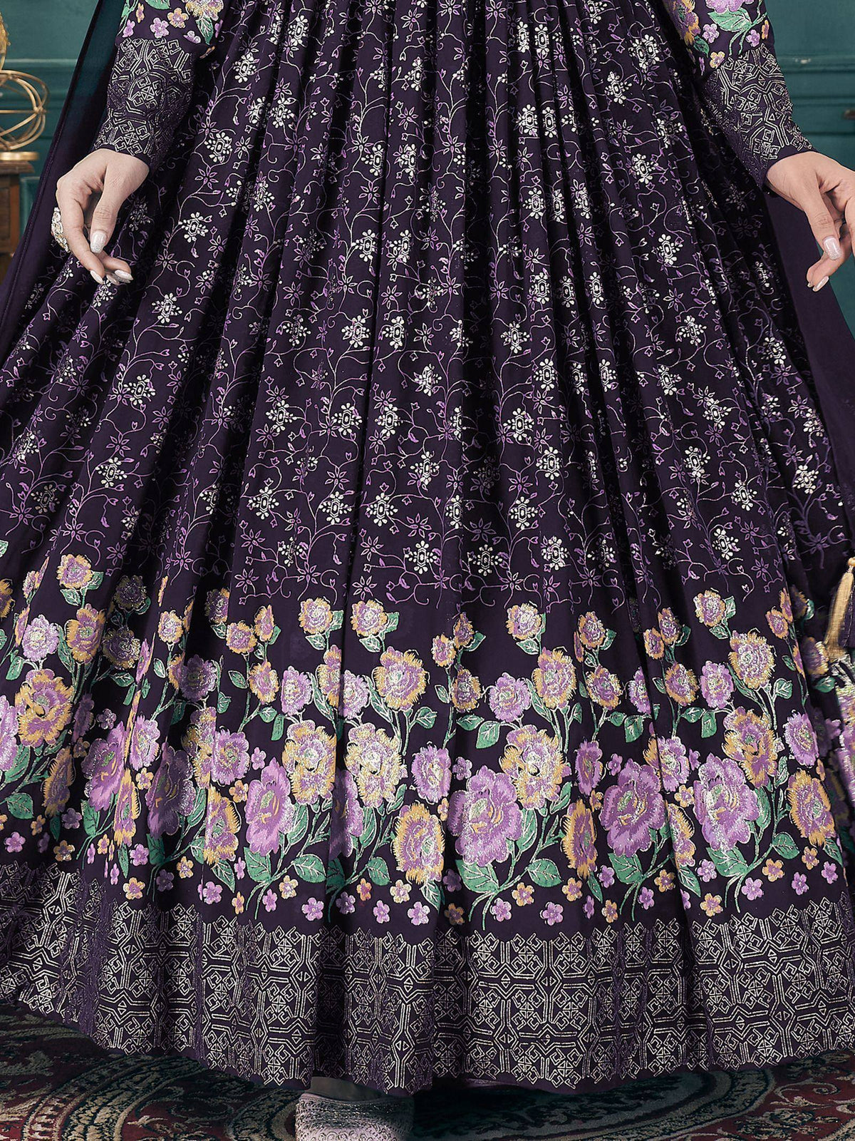 Purple floral print lehenga with intricate embroidery and geometric border, perfect for Indian ethnic occasions.