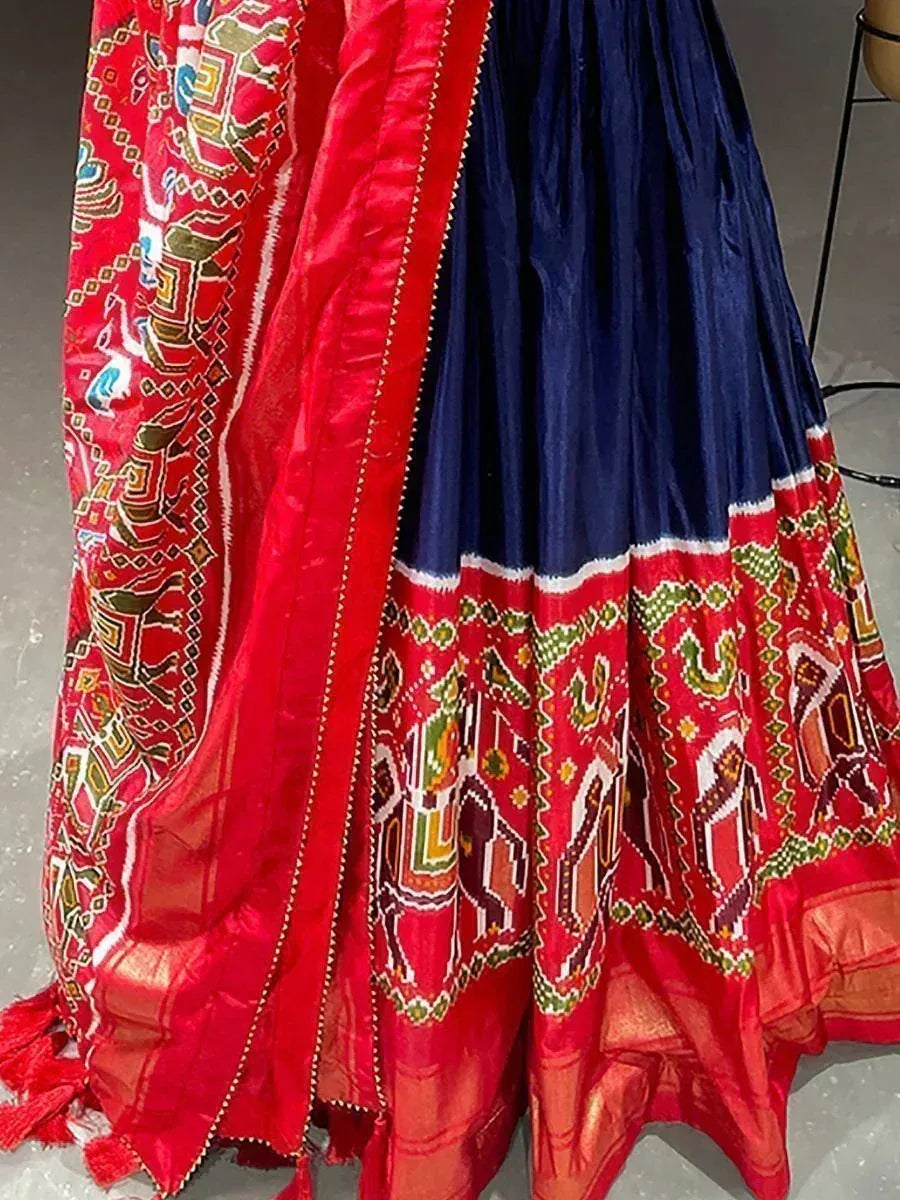 Red and navy blue ethnic lehenga with intricate elephant print and border detailing