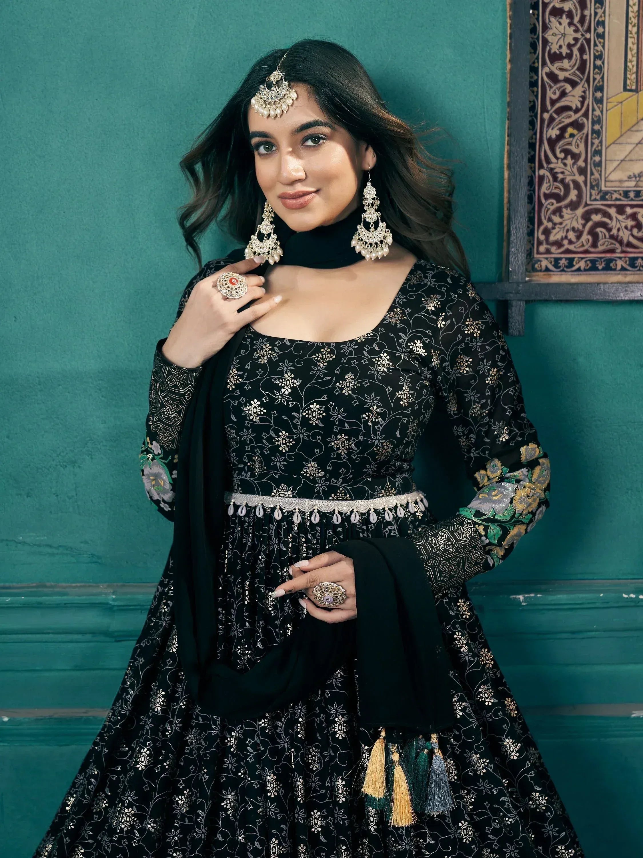 Black floral embroidered anarkali with gold detailing, paired with statement jewelry for ethnic wear