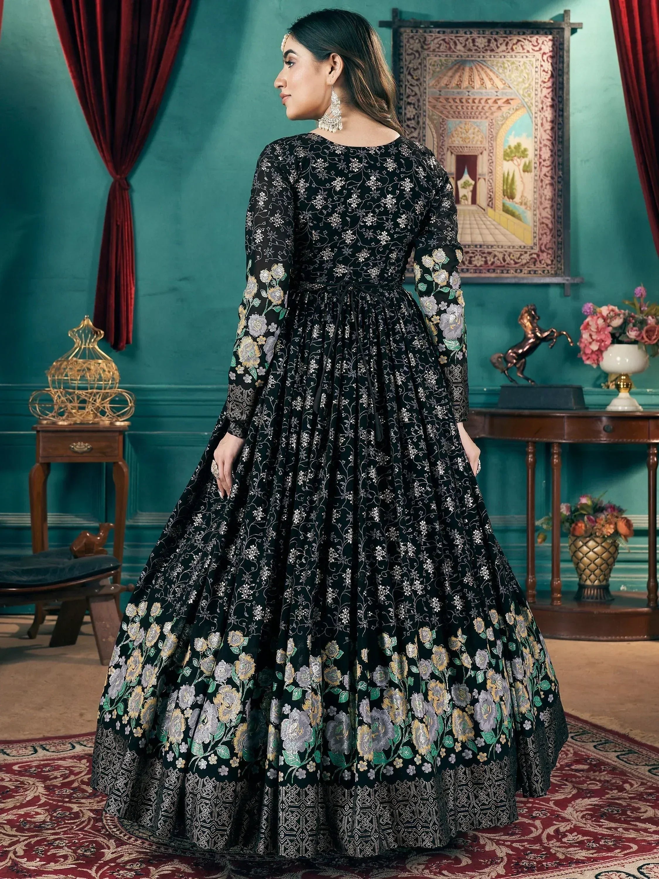 Black floral embroidered ethnic gown with long sleeves, perfect for Indian weddings and festive occasions.
