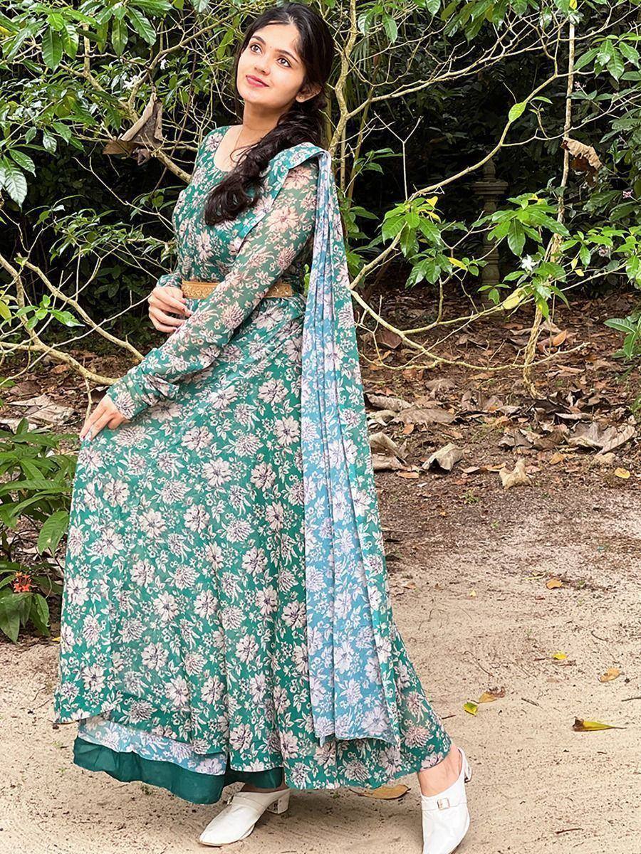Teal floral printed ethnic gown with matching dupatta, styled for women’s Indian wear