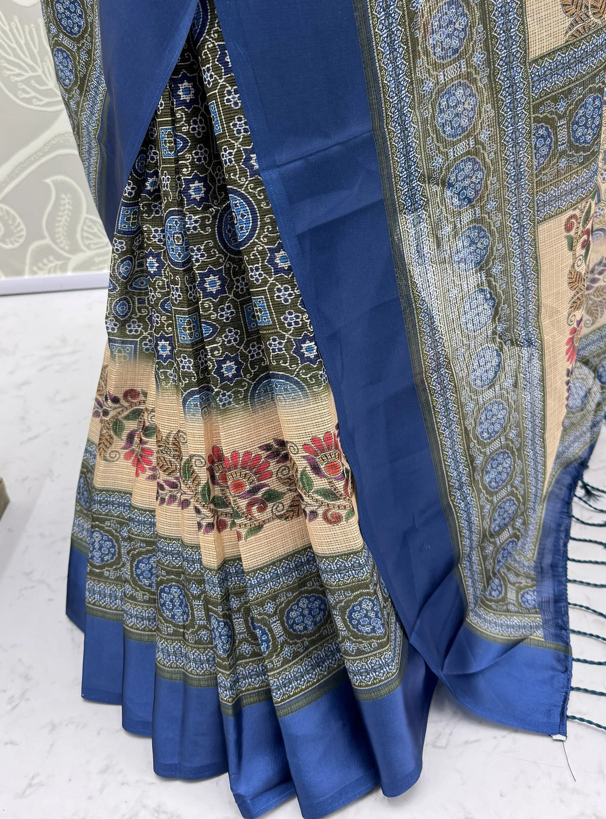 Close-up of a royal blue and olive green printed ethnic saree with floral patterns