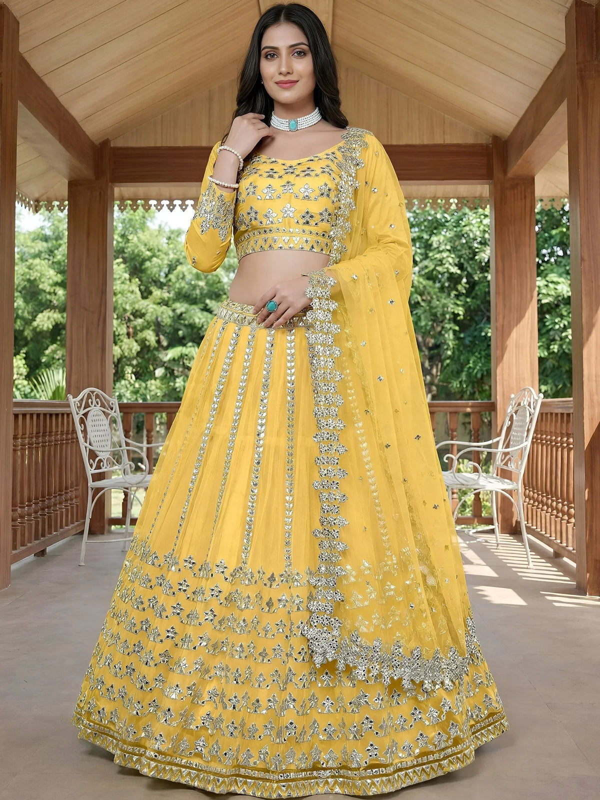 Yellow designer lehenga choli with silver mirror work, perfect for Indian ethnic wear occasions