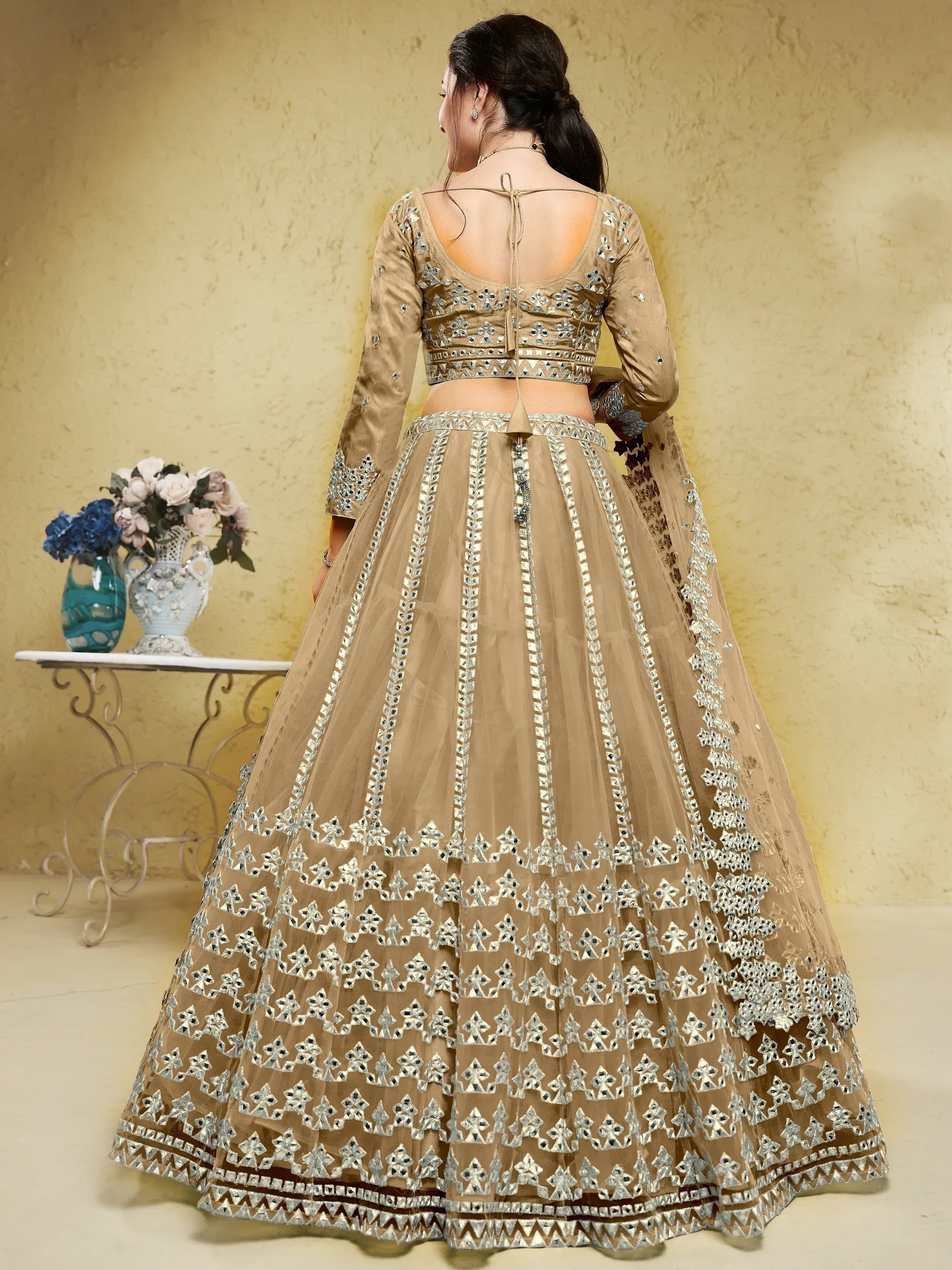 Beige lehenga choli with silver mirror work, back view, ethnic wear for women