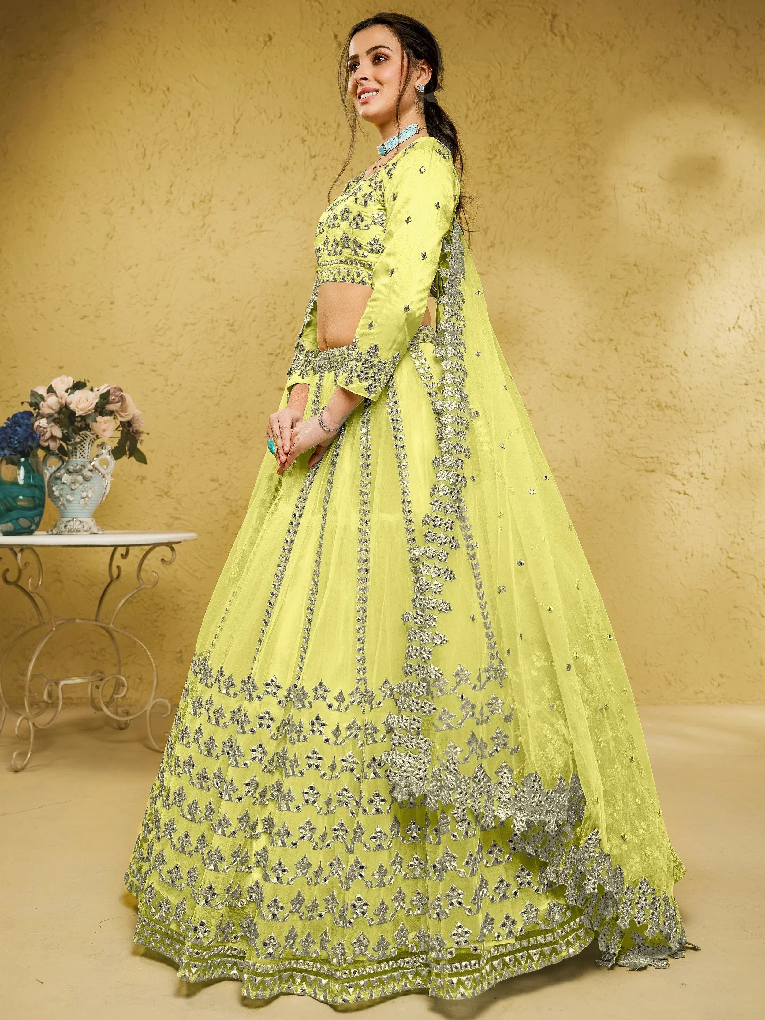Lime green designer lehenga choli with silver mirror work, perfect for Indian ethnic wear occasions