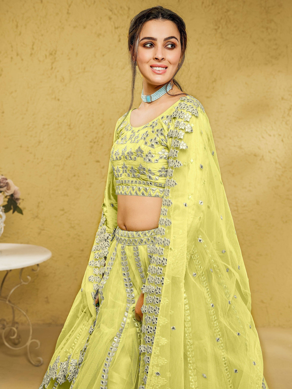 Lime green designer lehenga choli with silver mirror work and sheer dupatta for Indian ethnic wear
