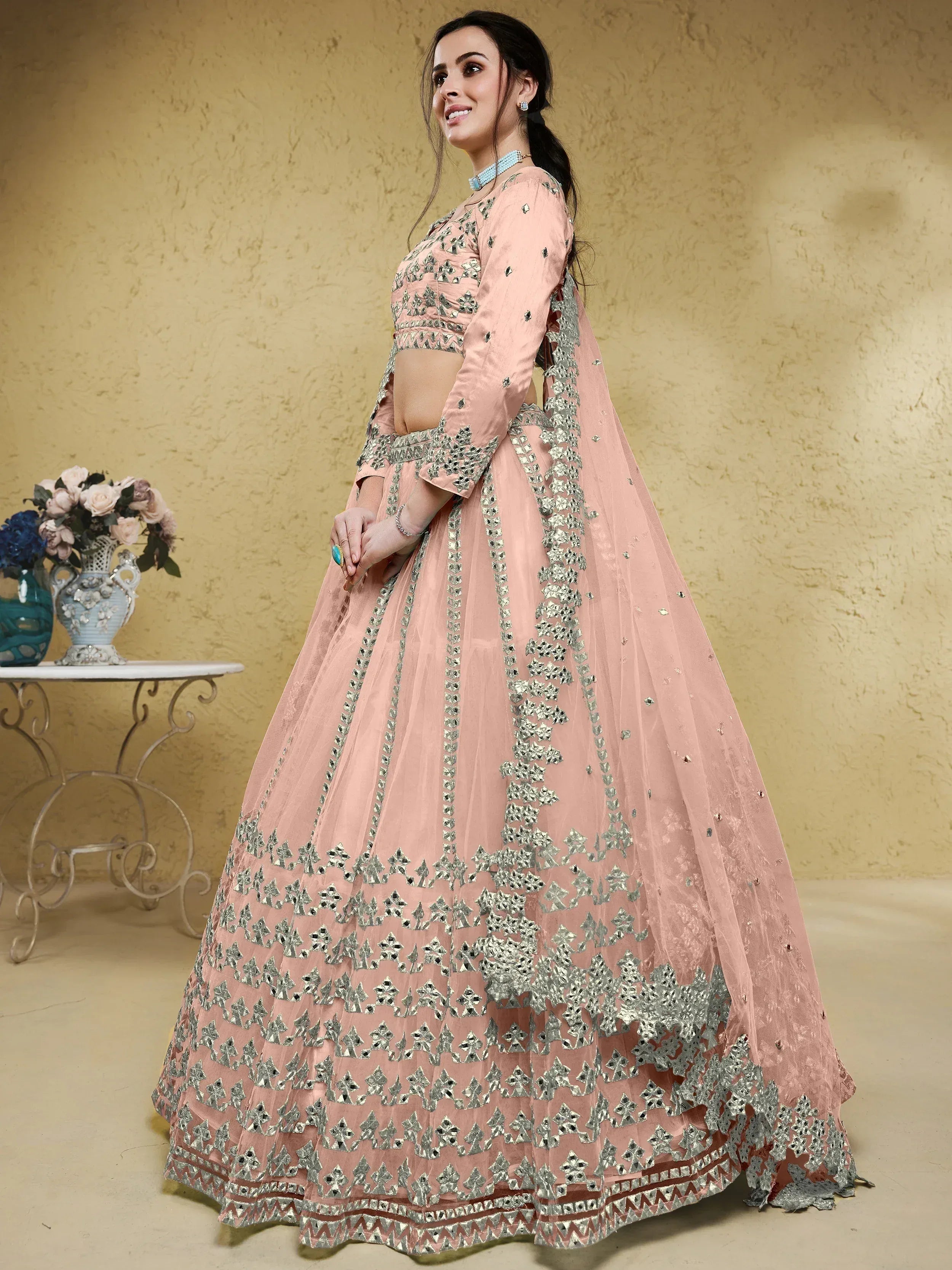 Pink designer lehenga choli with silver mirror work, perfect for Indian weddings and festive occasions