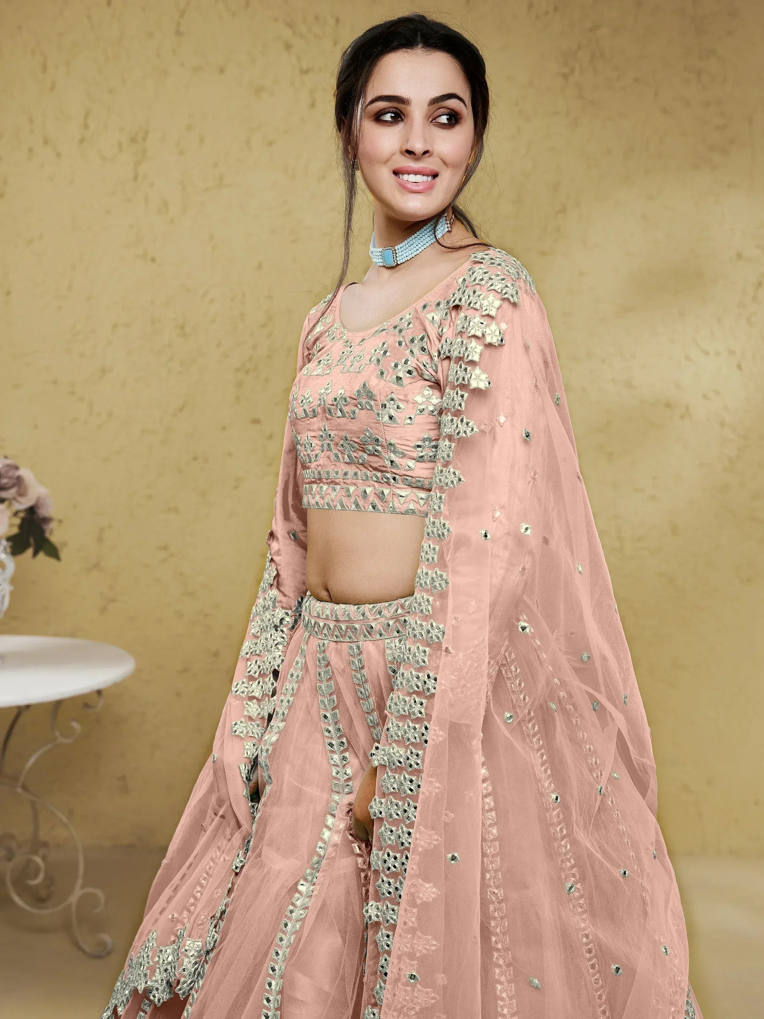 Pink designer lehenga choli with mirror work and net dupatta, perfect for Indian ethnic wear occasions