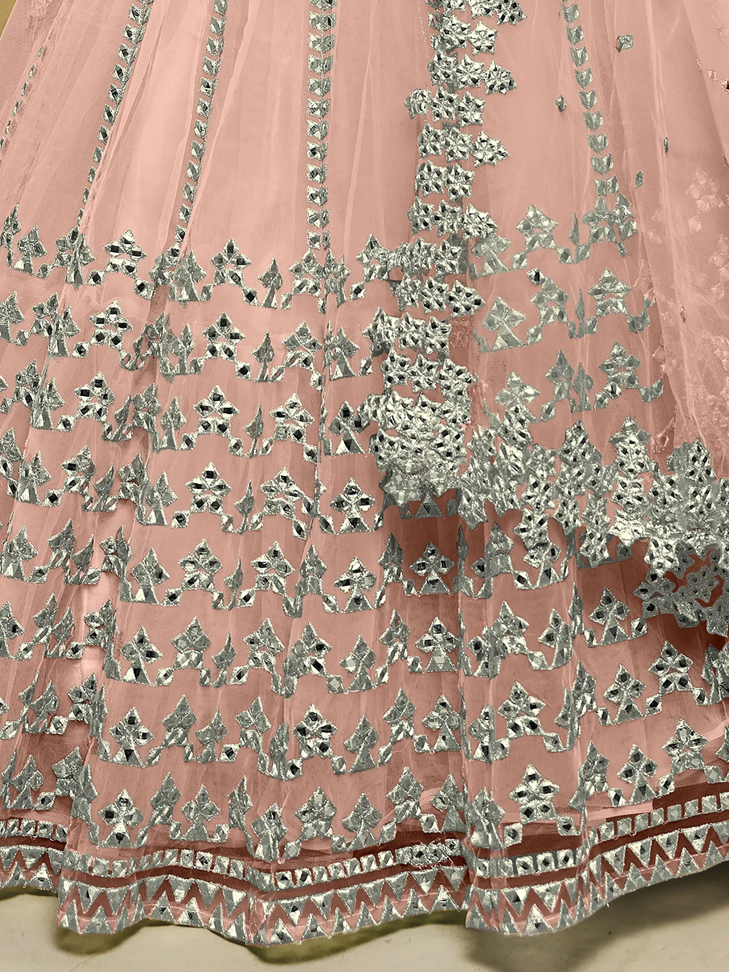 Pink ethnic lehenga skirt with silver mirror work and geometric embroidery details