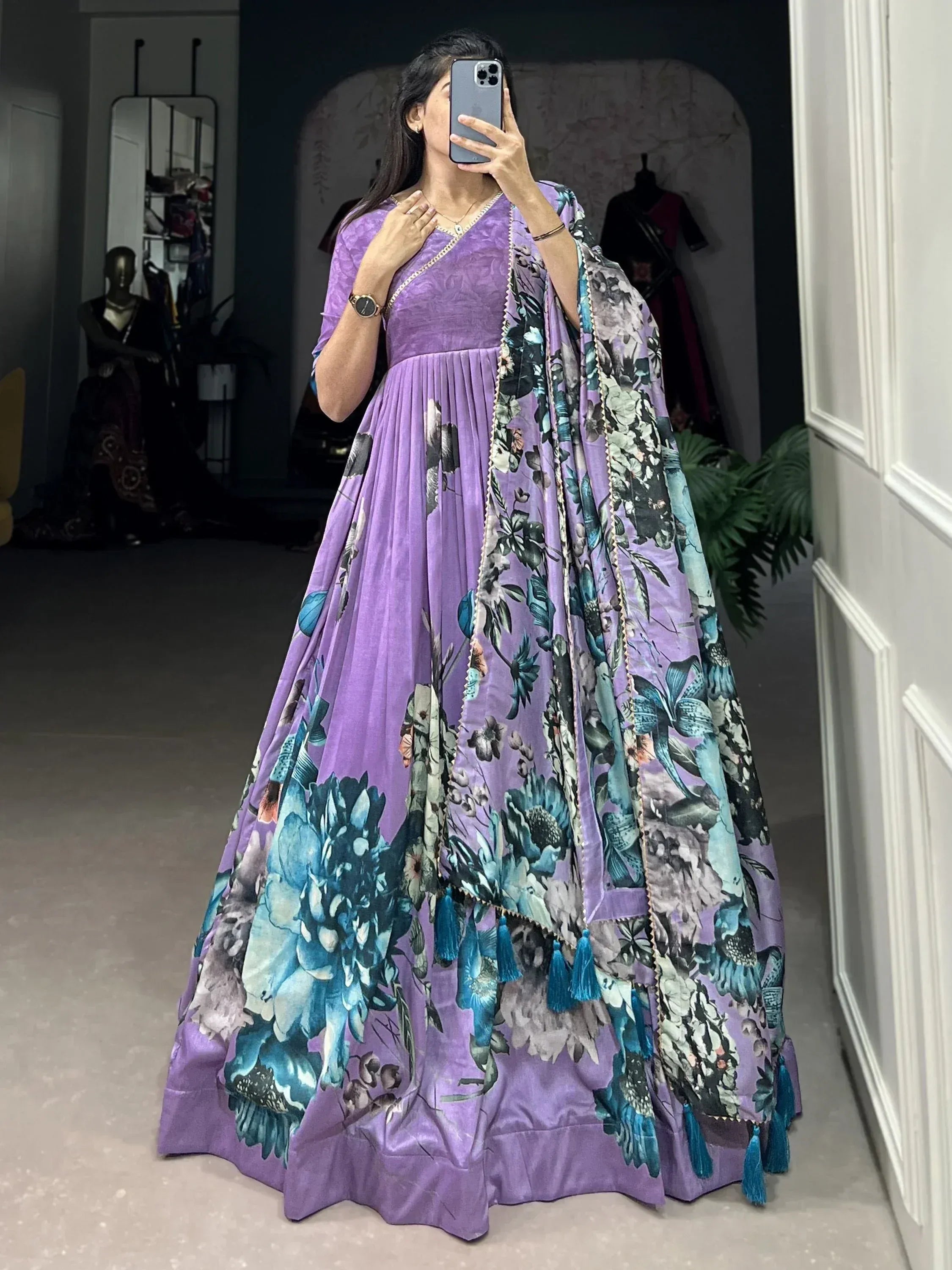 Purple floral print ethnic gown with tassels, perfect for Indian occasions and festive wear.