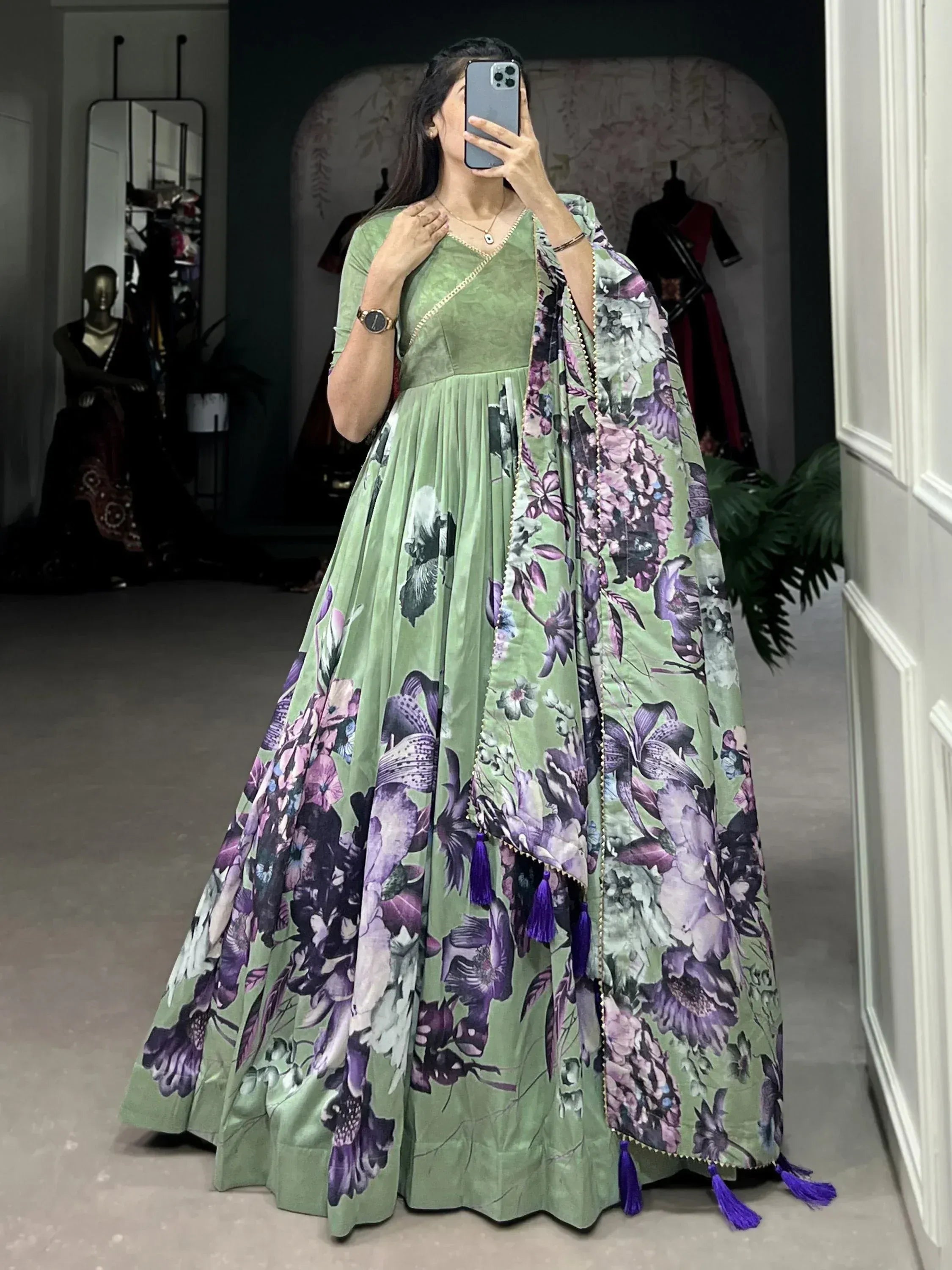 Green floral print anarkali gown with purple tassels, perfect for Indian ethnic occasions