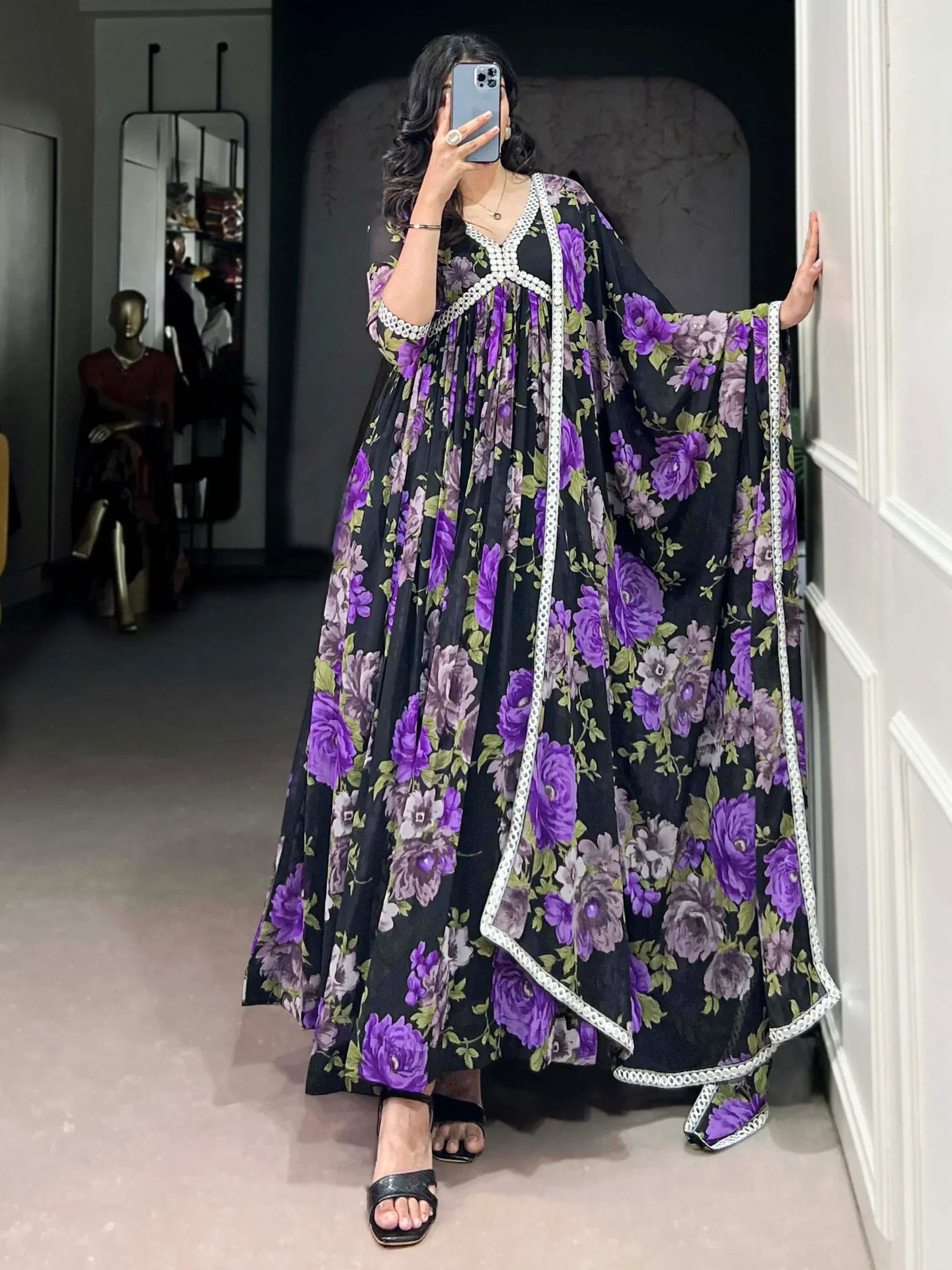 Purple floral ethnic gown with white trim, perfect for Indian occasions and festive wear.