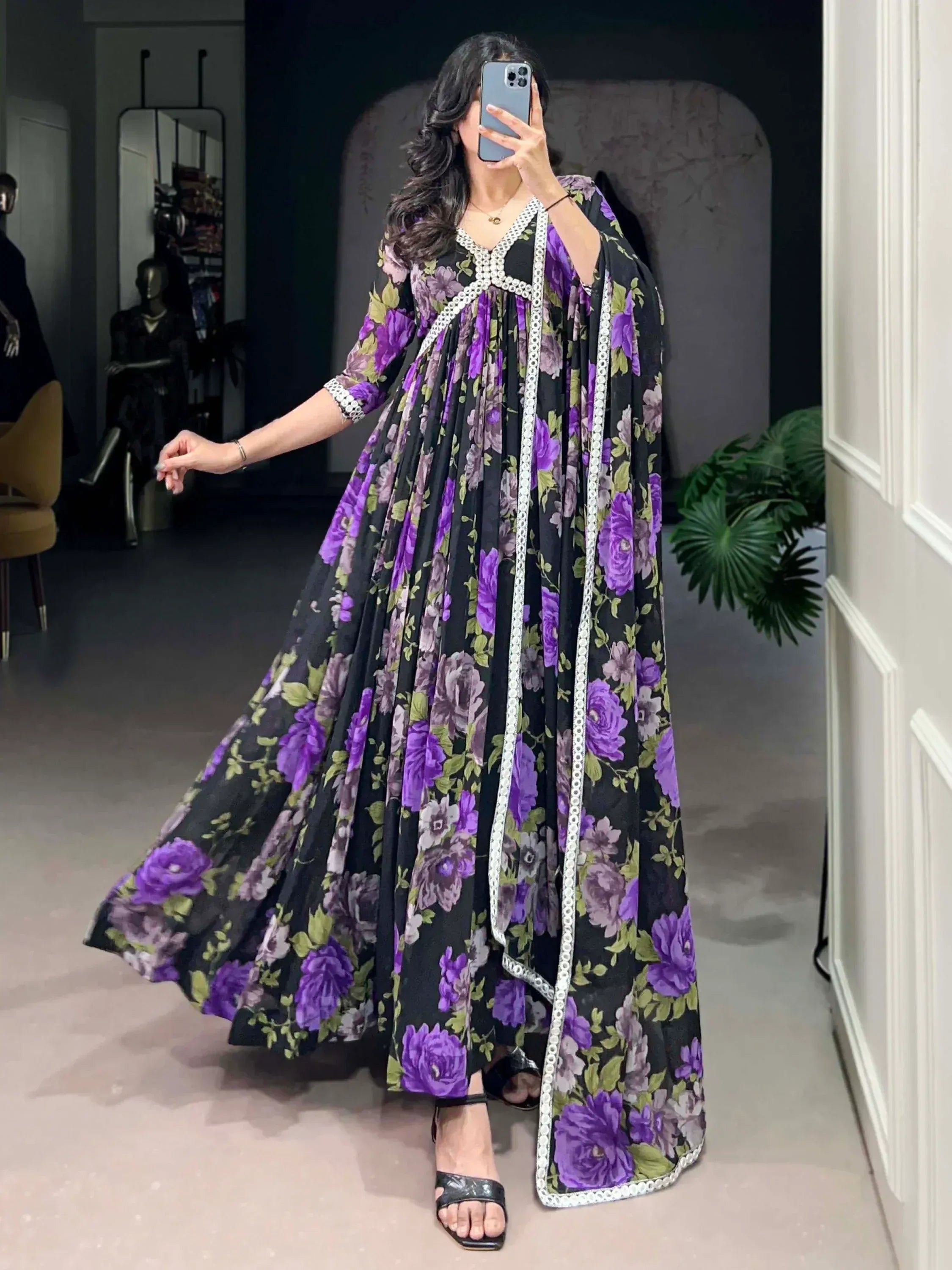 Purple floral ethnic gown with white lace trim, perfect for Indian occasions and festive wear.