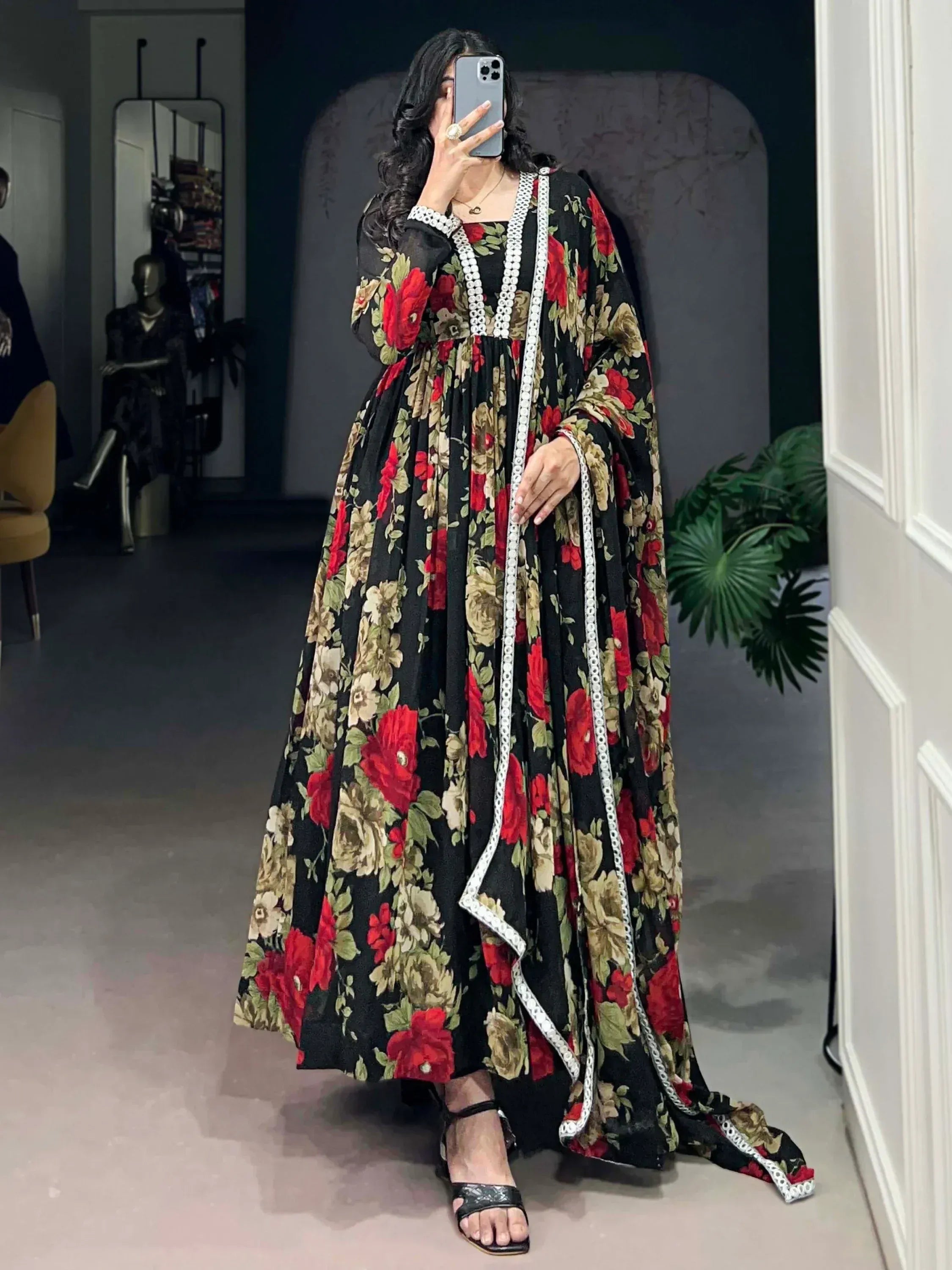 Black floral ethnic gown with red rose print and white trim, perfect for Indian occasions