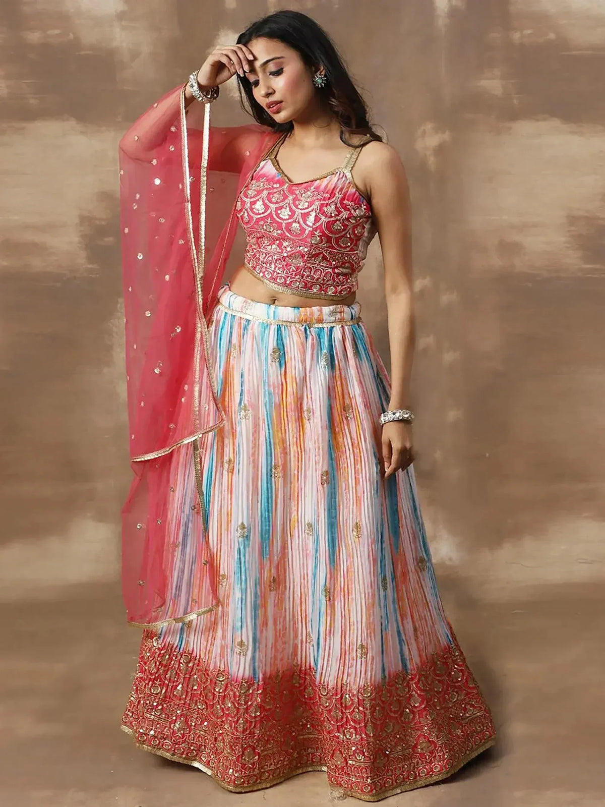 Designer lehenga choli with embroidered pink top, multicolor skirt, and matching dupatta for Indian ethnic wear