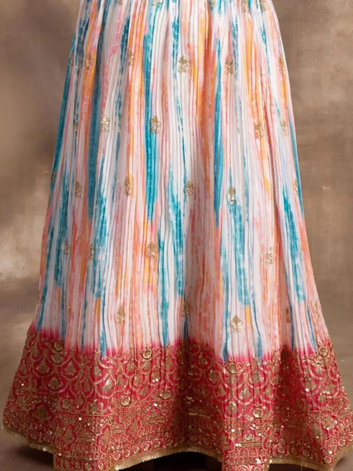 Colorful tie-dye lehenga skirt with gold embroidery and red border, Indian ethnic wear