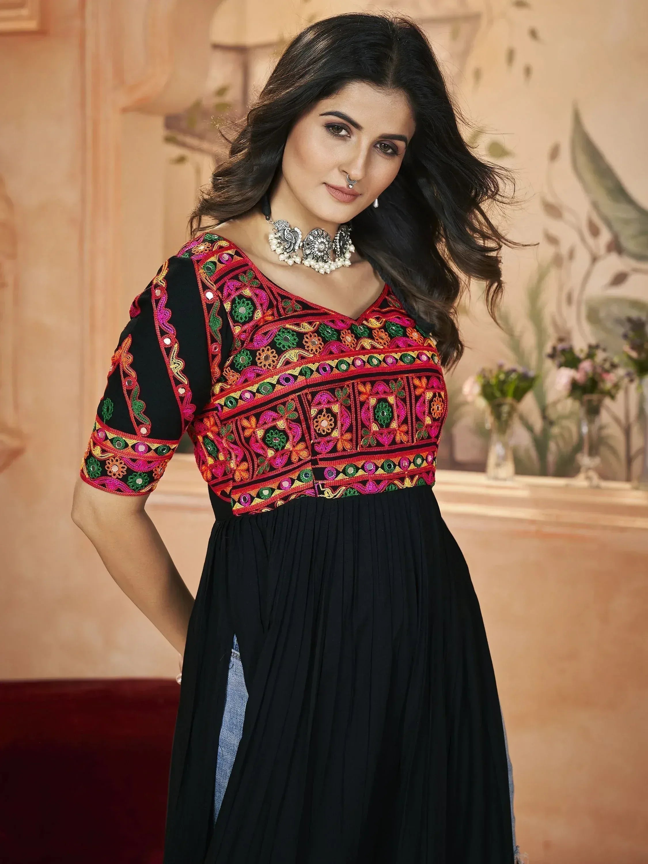 Black ethnic gown with vibrant mirror embroidery, perfect for Indian festive wear