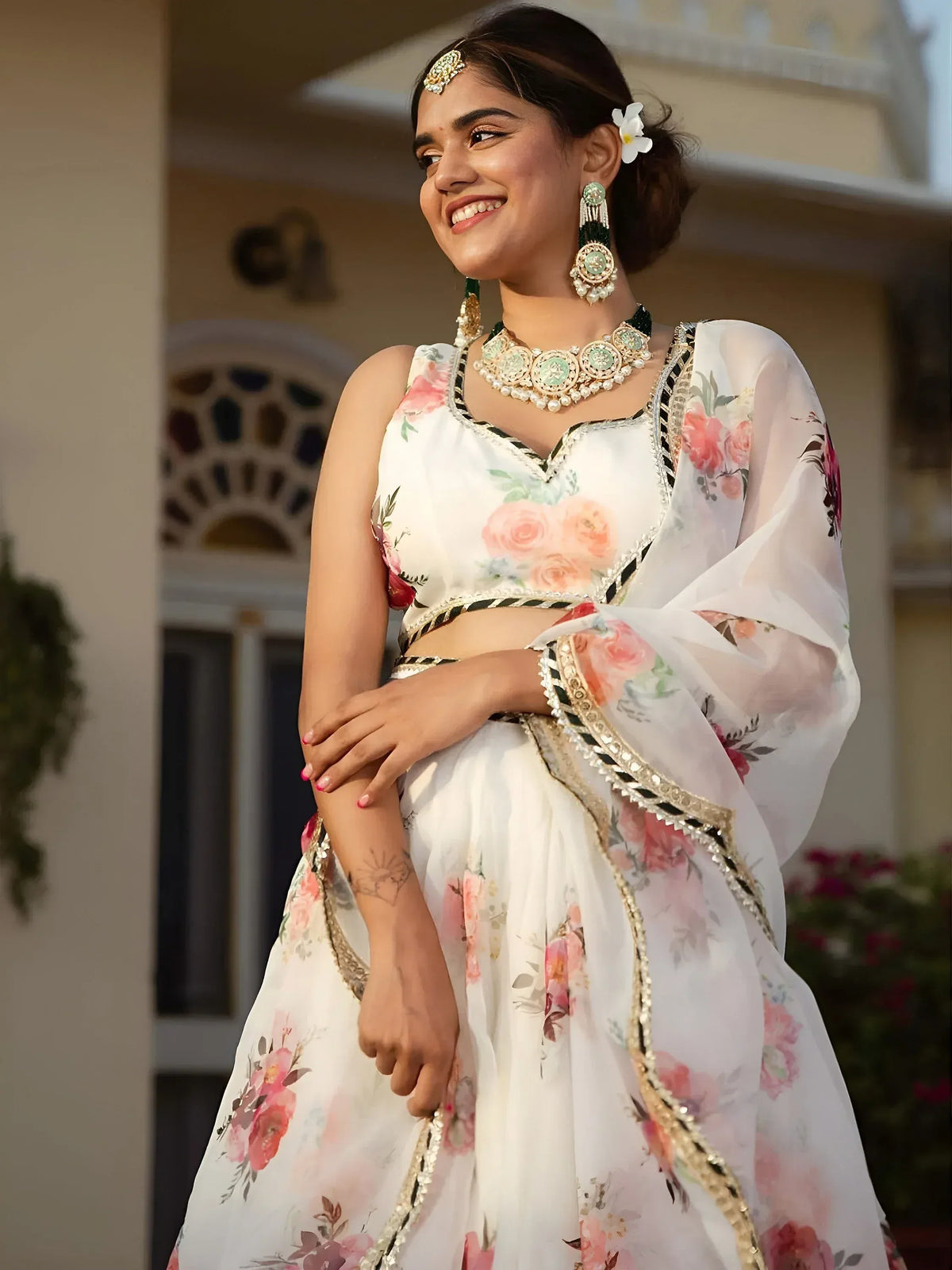 White floral lehenga choli with gold trim, perfect for Indian ethnic wear and festive occasions.