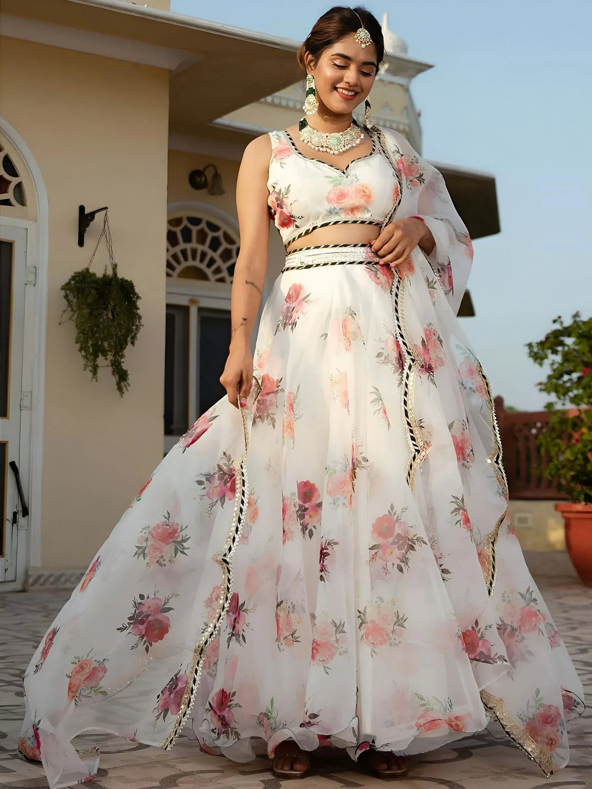 White floral lehenga choli with gold trim, perfect for Indian ethnic wear and festive occasions.
