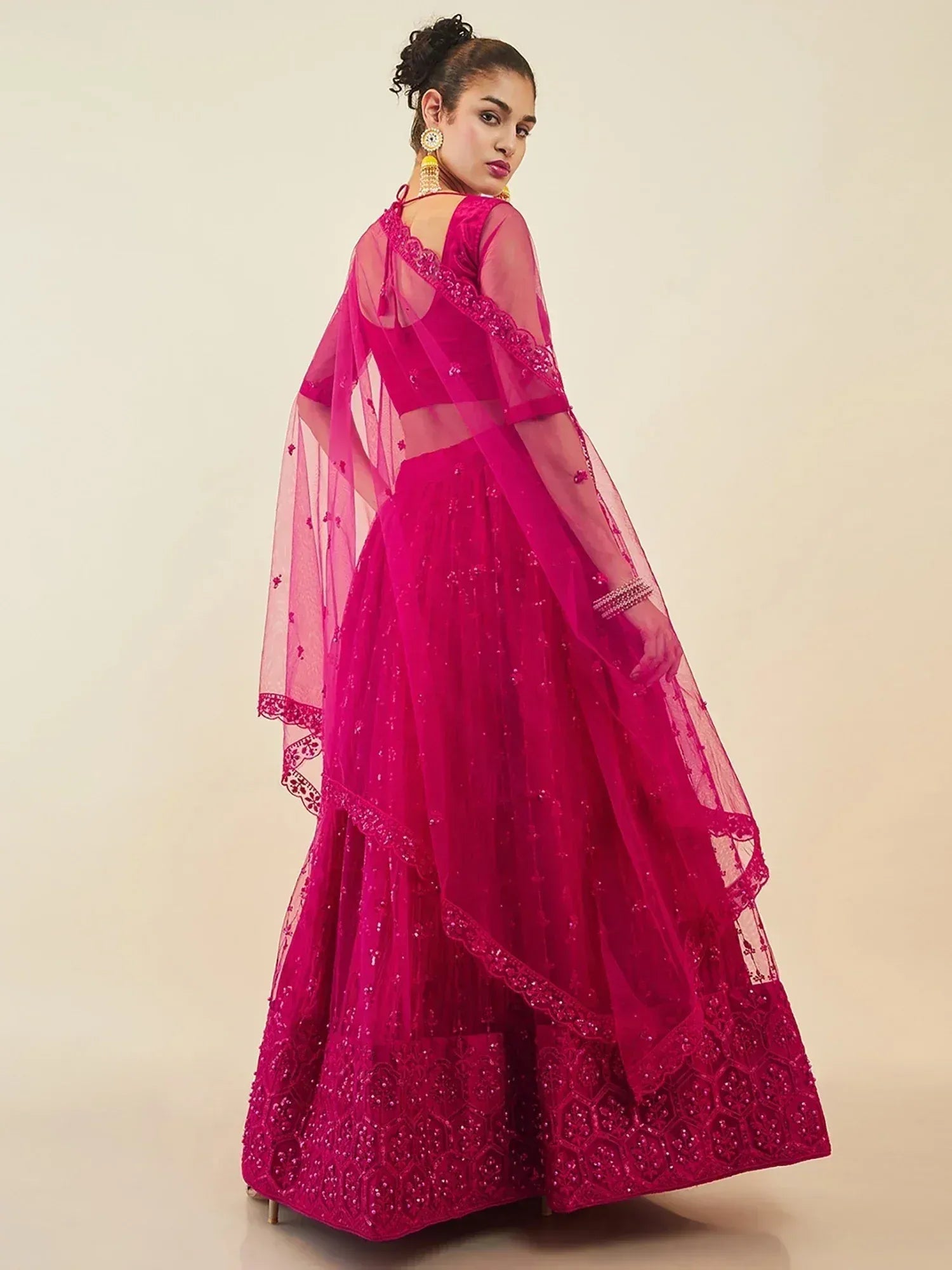Fuchsia designer lehenga choli with sequin embroidery and sheer dupatta for Indian ethnic wear