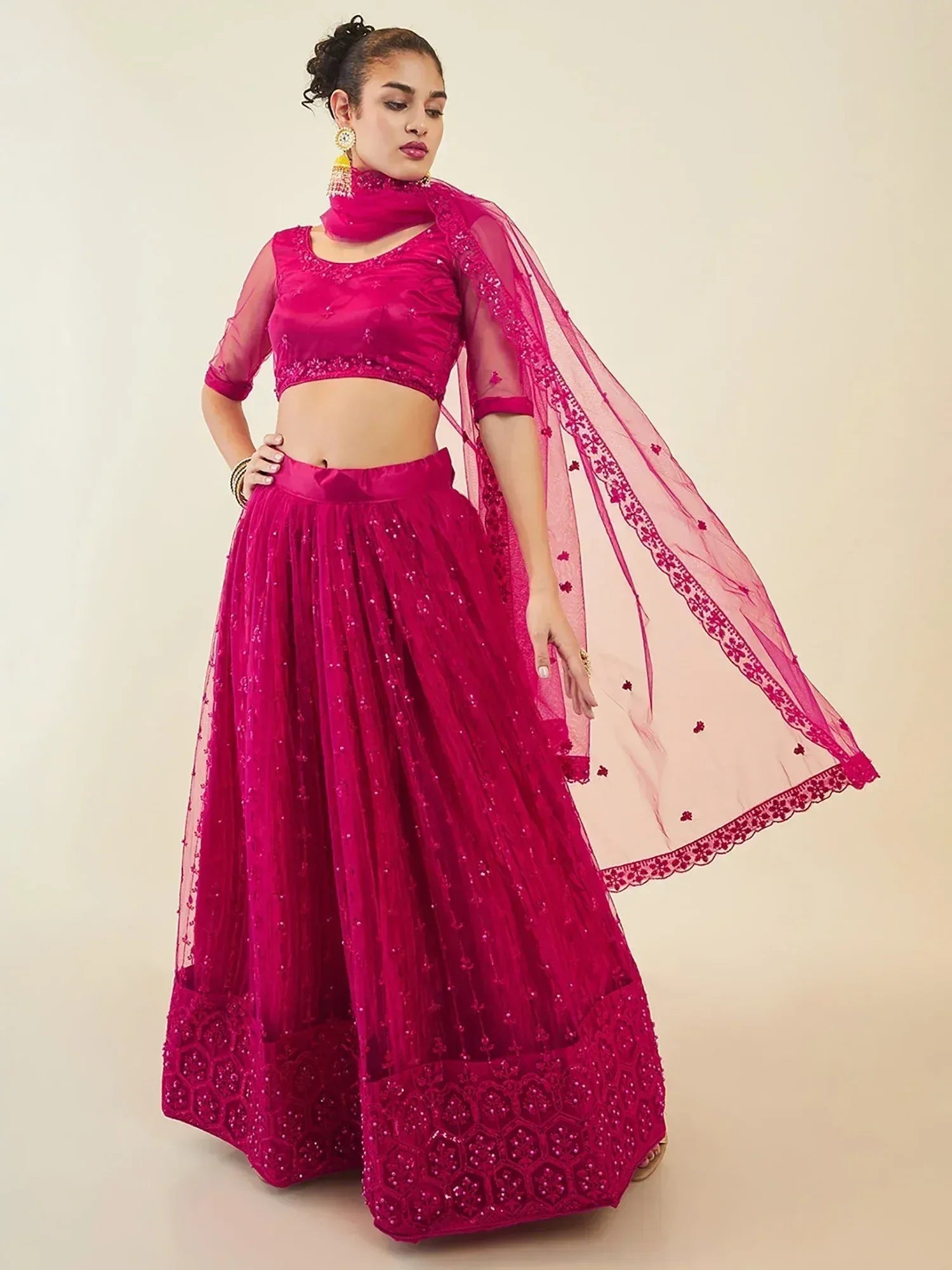 Fuchsia pink embroidered lehenga choli with sheer dupatta, perfect for Indian ethnic wear