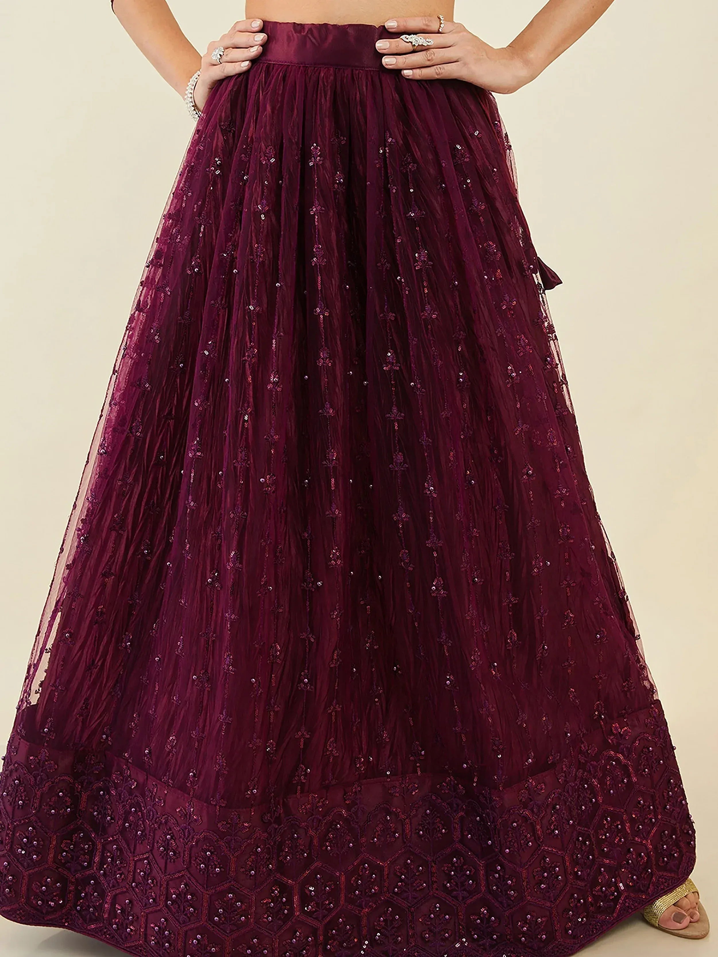 Elegant maroon lehenga skirt with intricate beadwork and floral embroidery for Indian ethnic wear