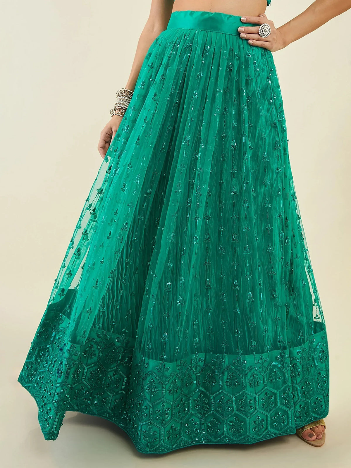 Emerald green embroidered lehenga skirt with sequin detailing and flared design