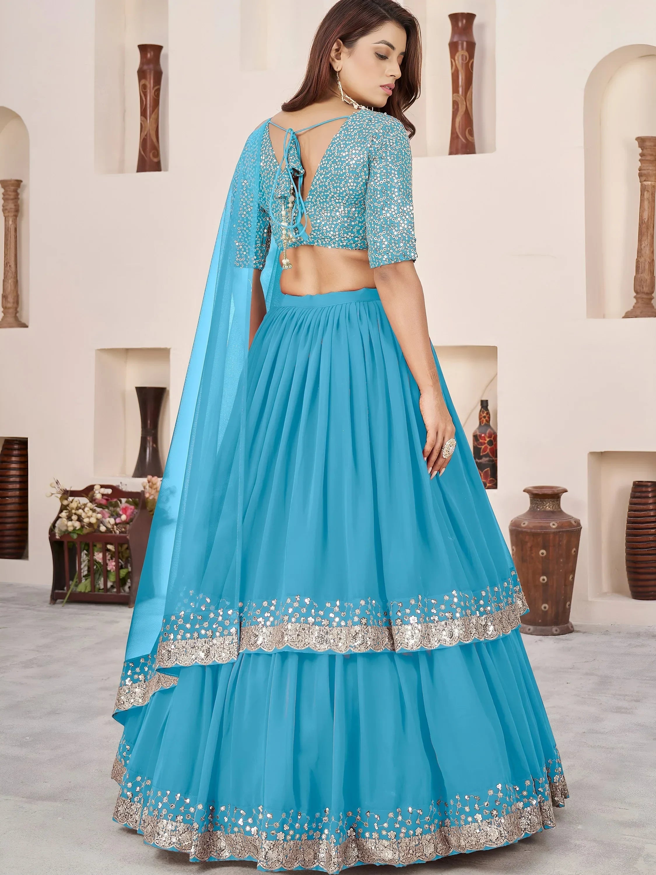 Dazzling Sky Blue Sequins Georgette Sangeet Wear Lehenga Choli
