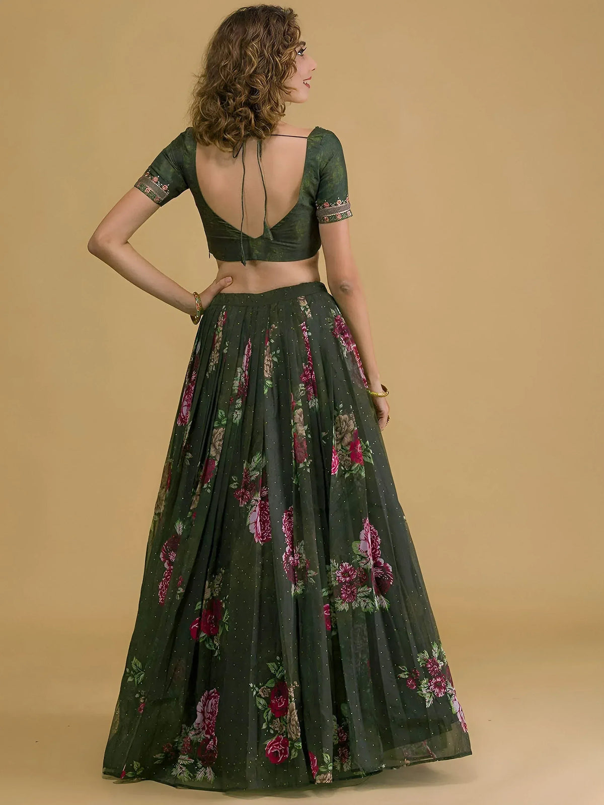 Green floral lehenga choli with backless blouse, perfect for Indian ethnic occasions
