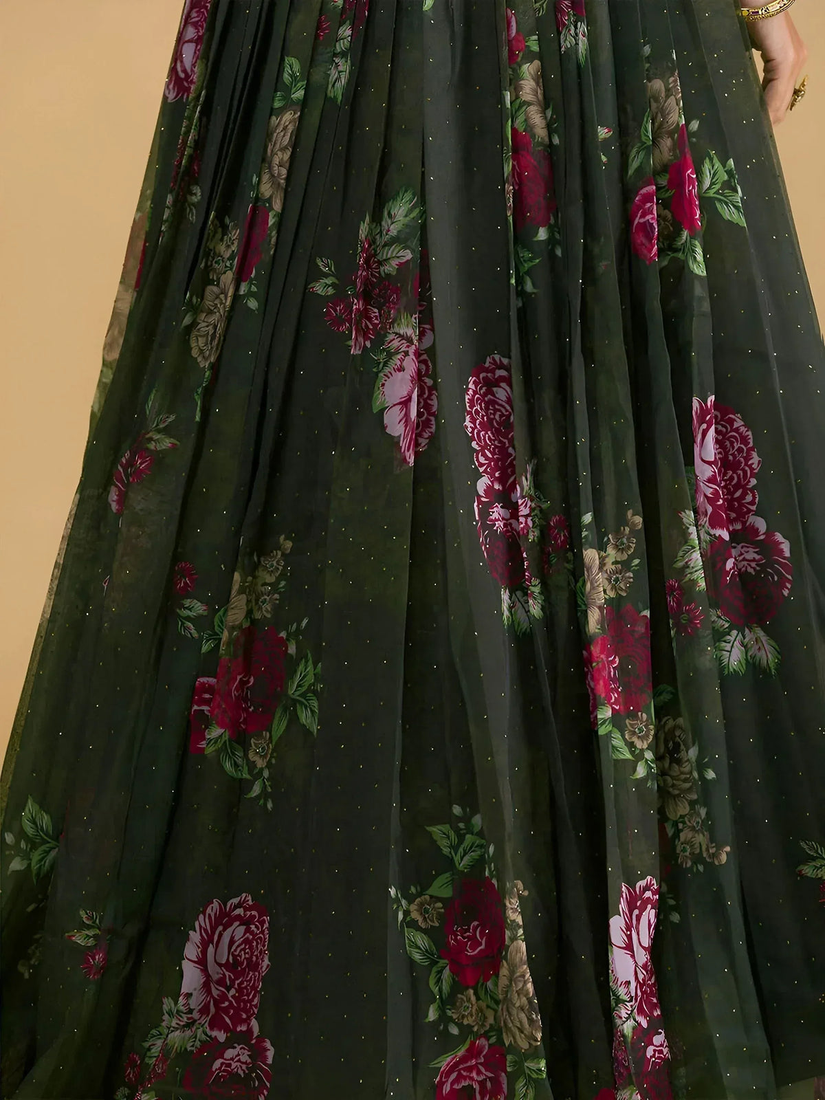Dark green floral lehenga skirt with red and pink rose print and subtle gold glitter details
