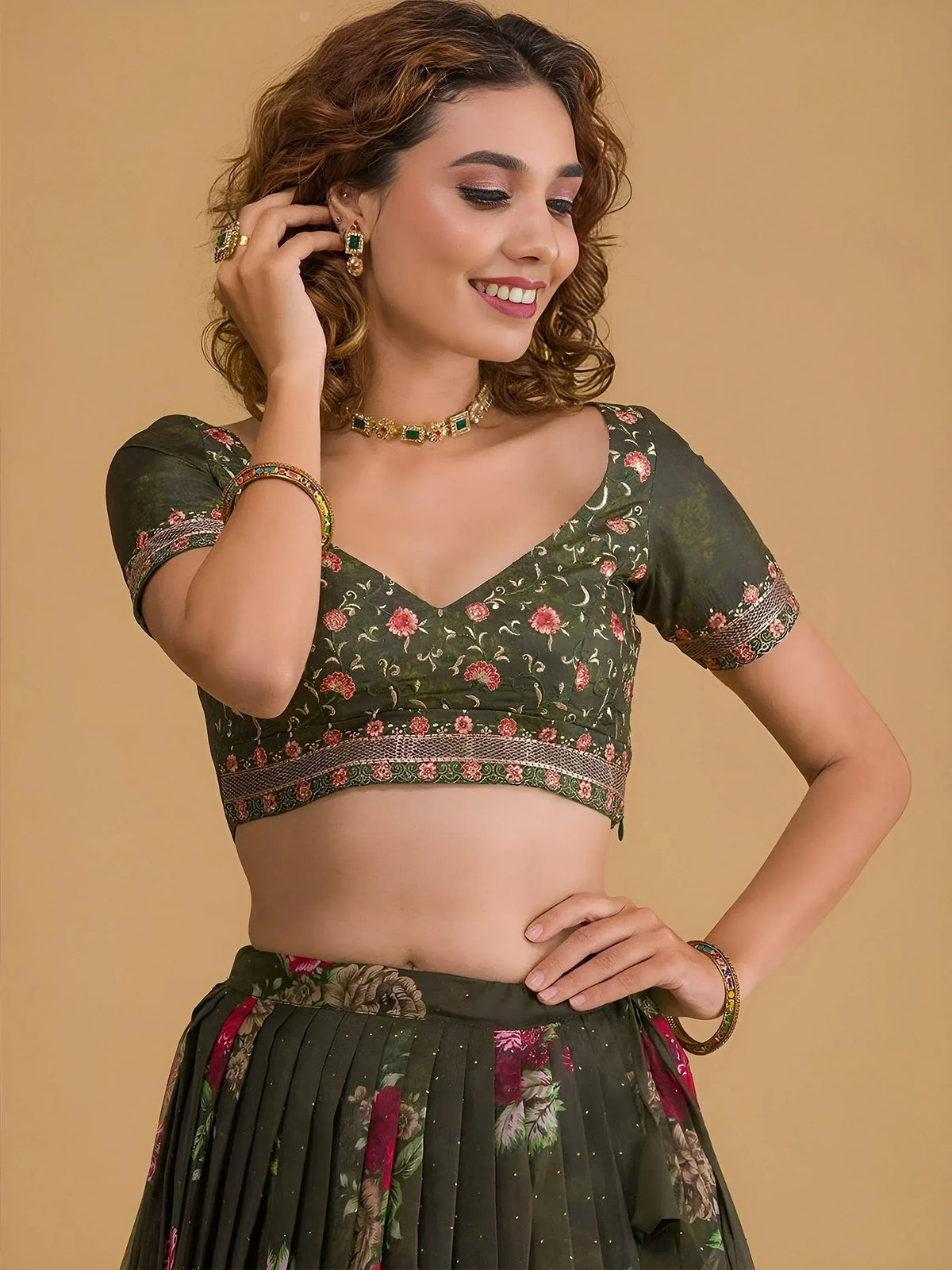 Green floral lehenga choli with embroidered blouse and pleated skirt, perfect for Indian ethnic wear